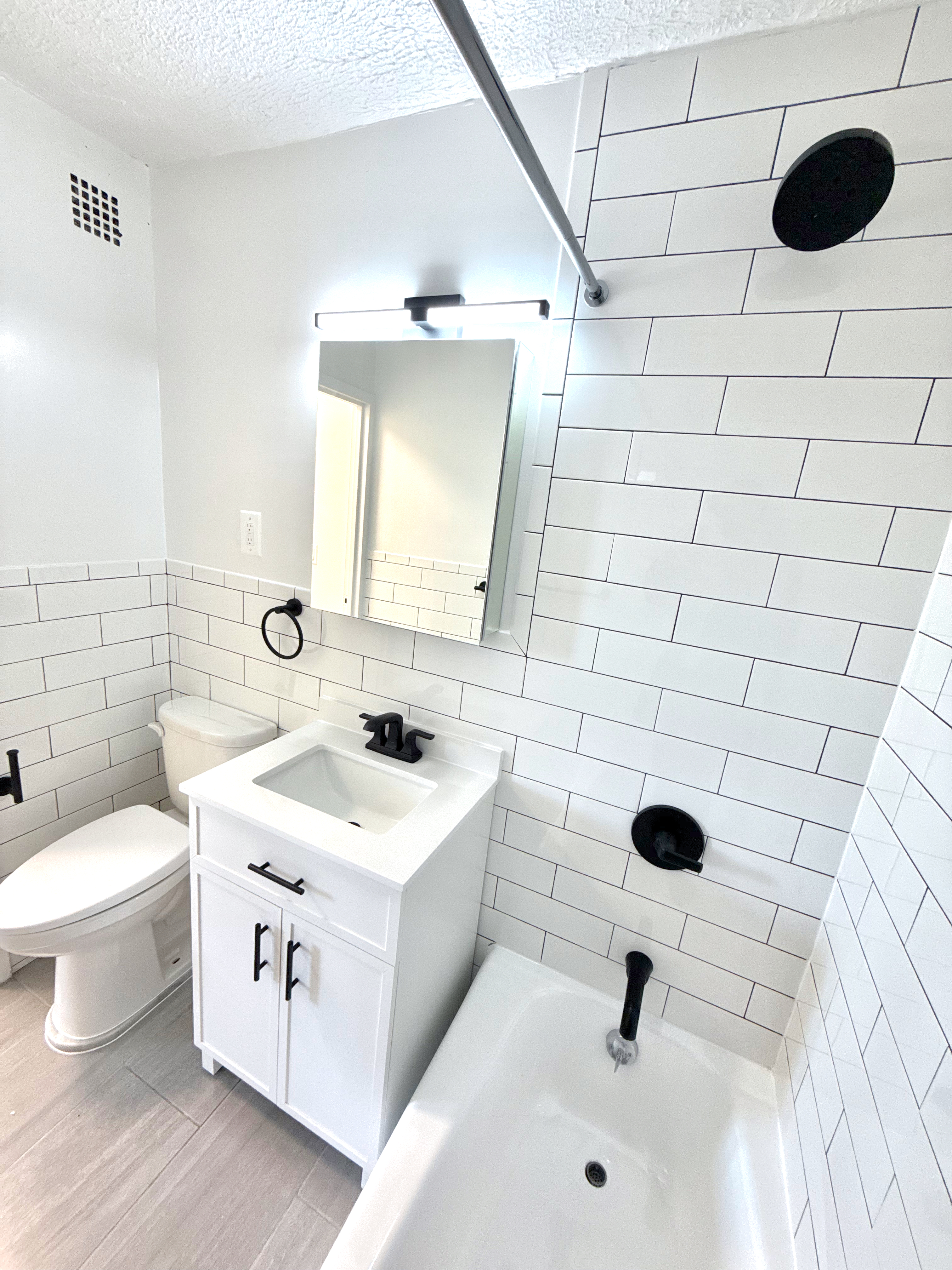 3333 Broadway, Unit D8J Manhattan, NY 10031 - Photo 9 of 22 a bathroom with a sink and a toilet