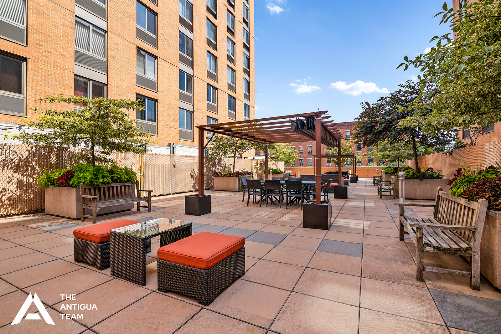 300 West 135th Street, Unit 2M Manhattan, NY 10030 - Photo 7 of 8 a view of a patio with dining table and chairs with potted plants