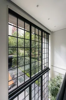 a kitchen with sink stove and wooden floor