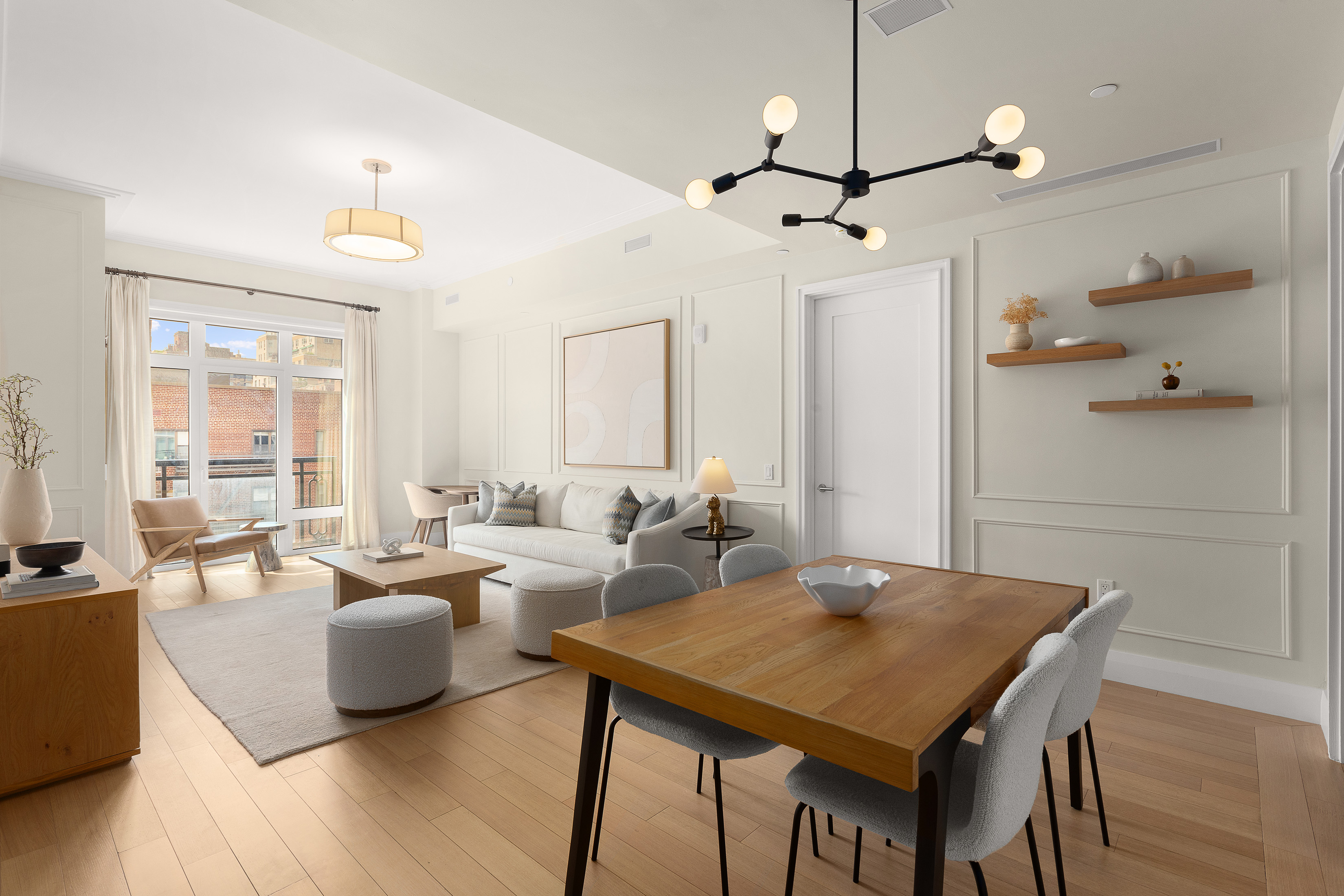 a view of a dining room with furniture and wooden floor