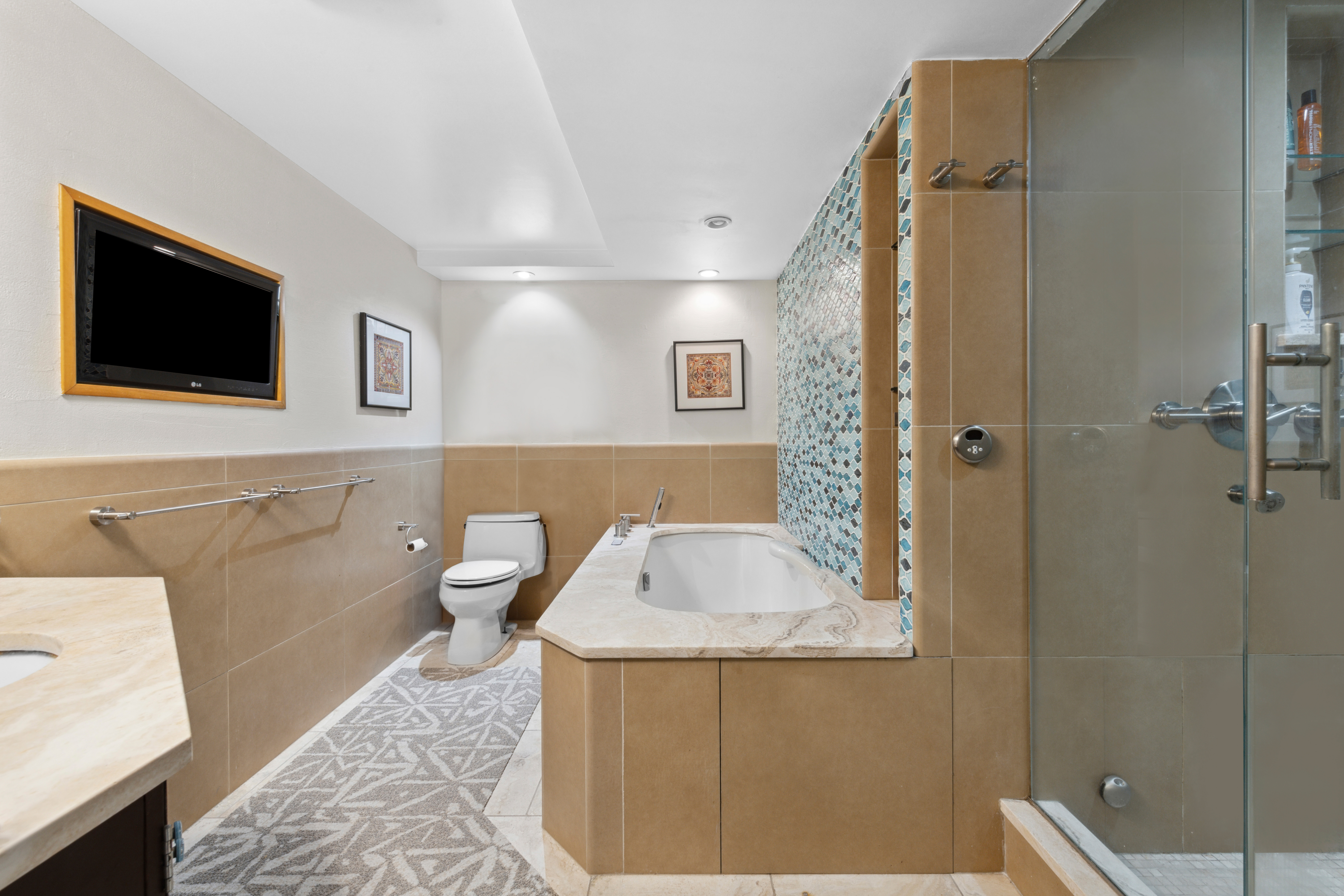 400 East 77th Street, Unit 1CD Manhattan, NY 10075 - Photo 11 of 18 a bathroom with a sink toilet and shower