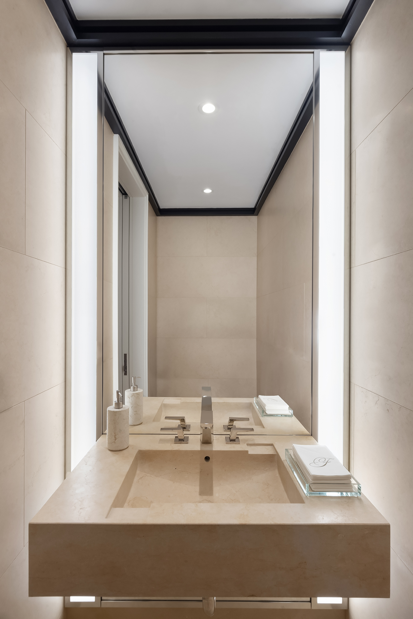 53 West 53rd Street, Unit 23D Manhattan, NY 10019 - Photo 10 of 11 a bathroom with a sink and a mirror