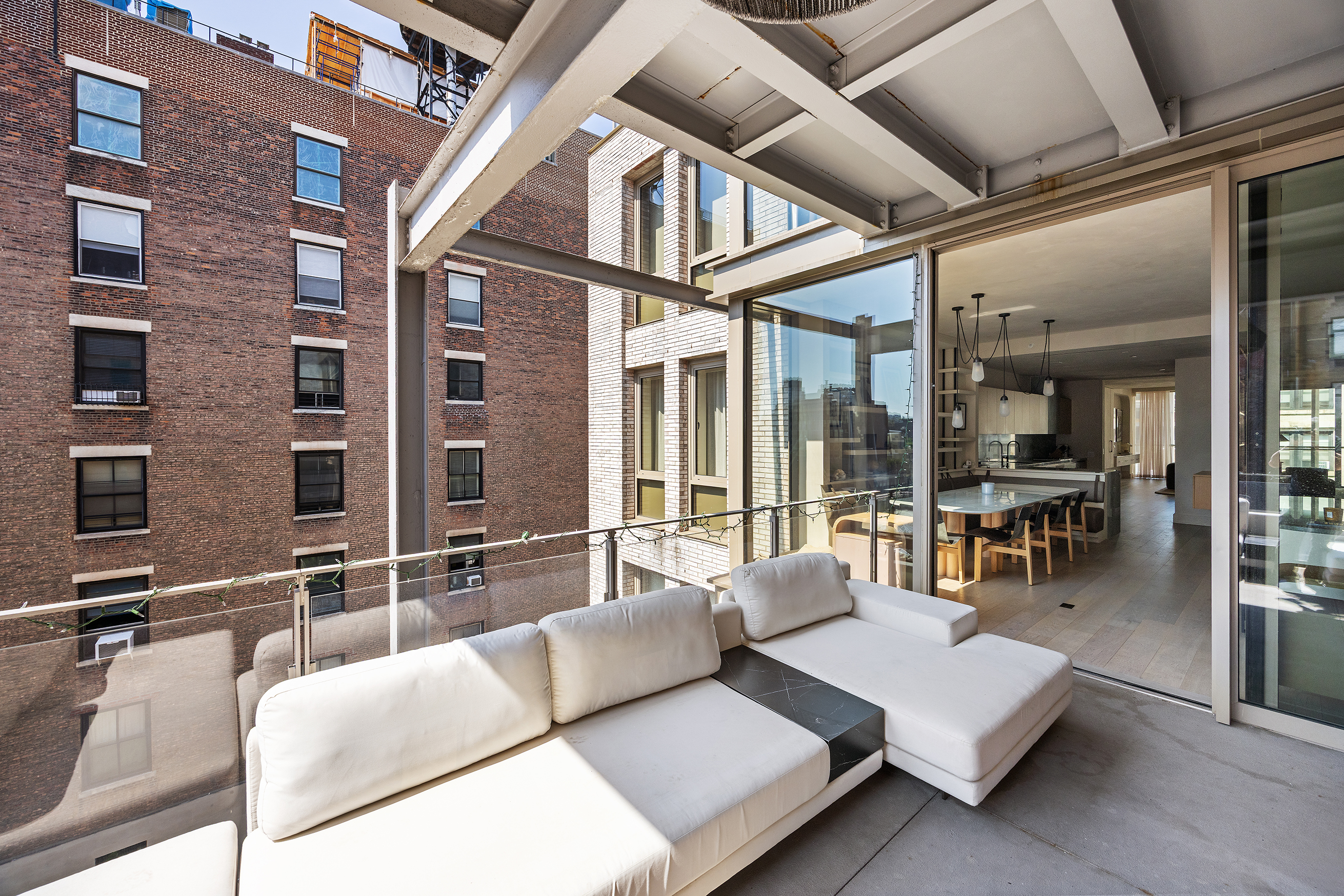1 Great Jones Alley, Unit 10 Manhattan, NY 10012 - Photo 9 of 41 a balcony with furniture and outdoor seating