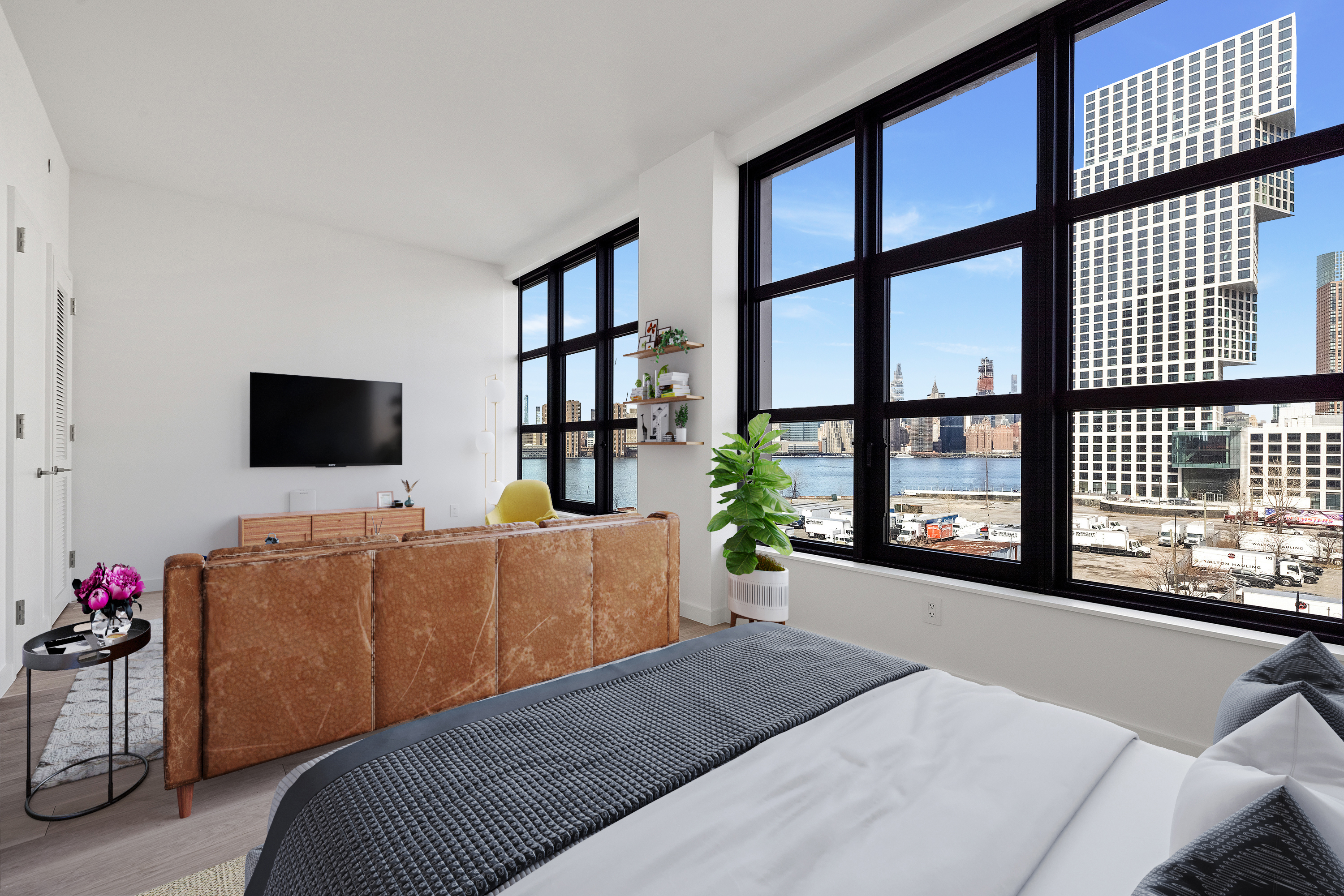 29 Huron Street, Unit 6AE Brooklyn, NY 11222 - Photo 2 of 13 a living room with furniture and a flat screen tv