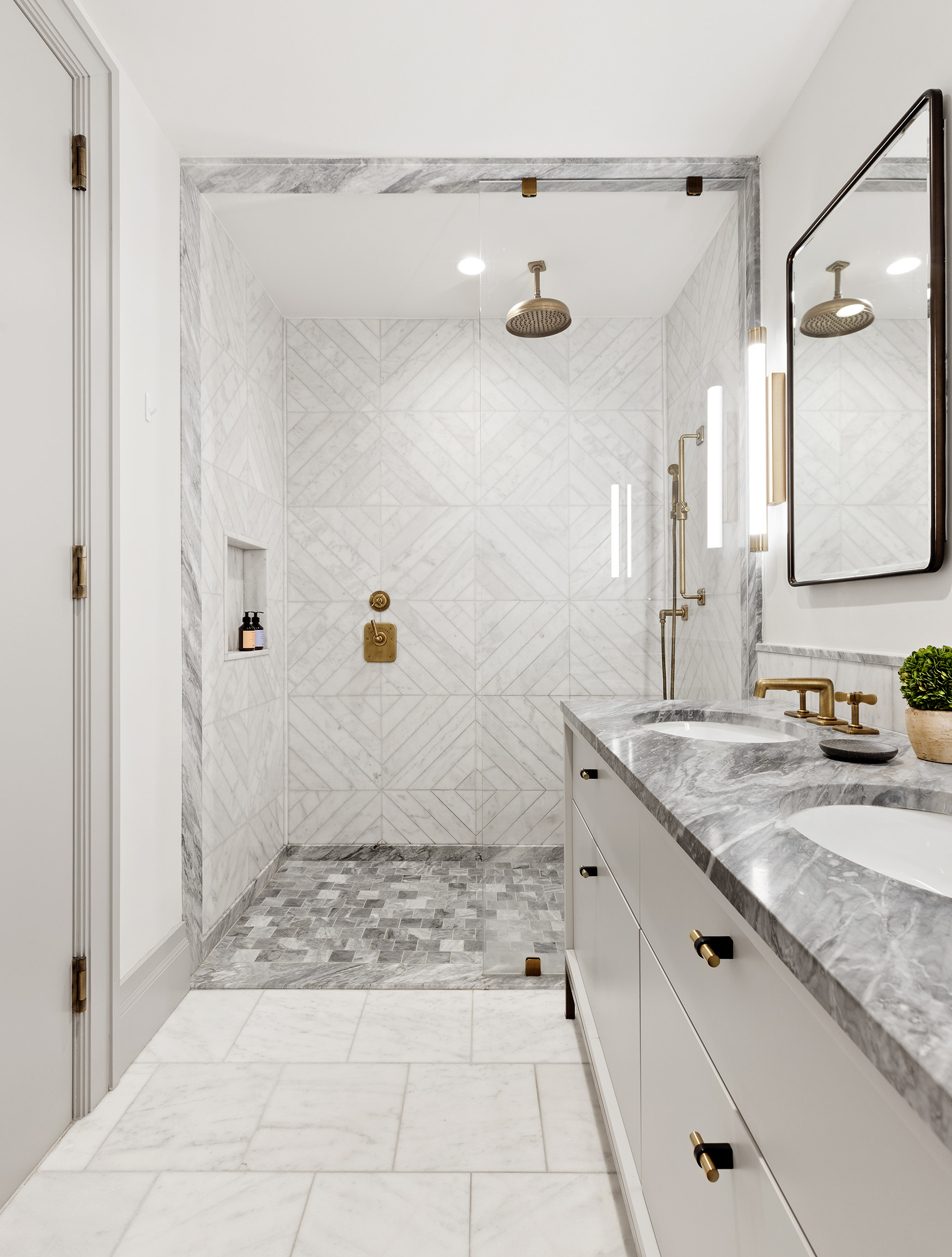 76 Schermerhorn Street, Unit 2C Brooklyn, NY 11201 - Photo 5 of 16 a bathroom with a granite countertop sink a mirror and shower