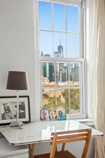 a living room with a large window and table