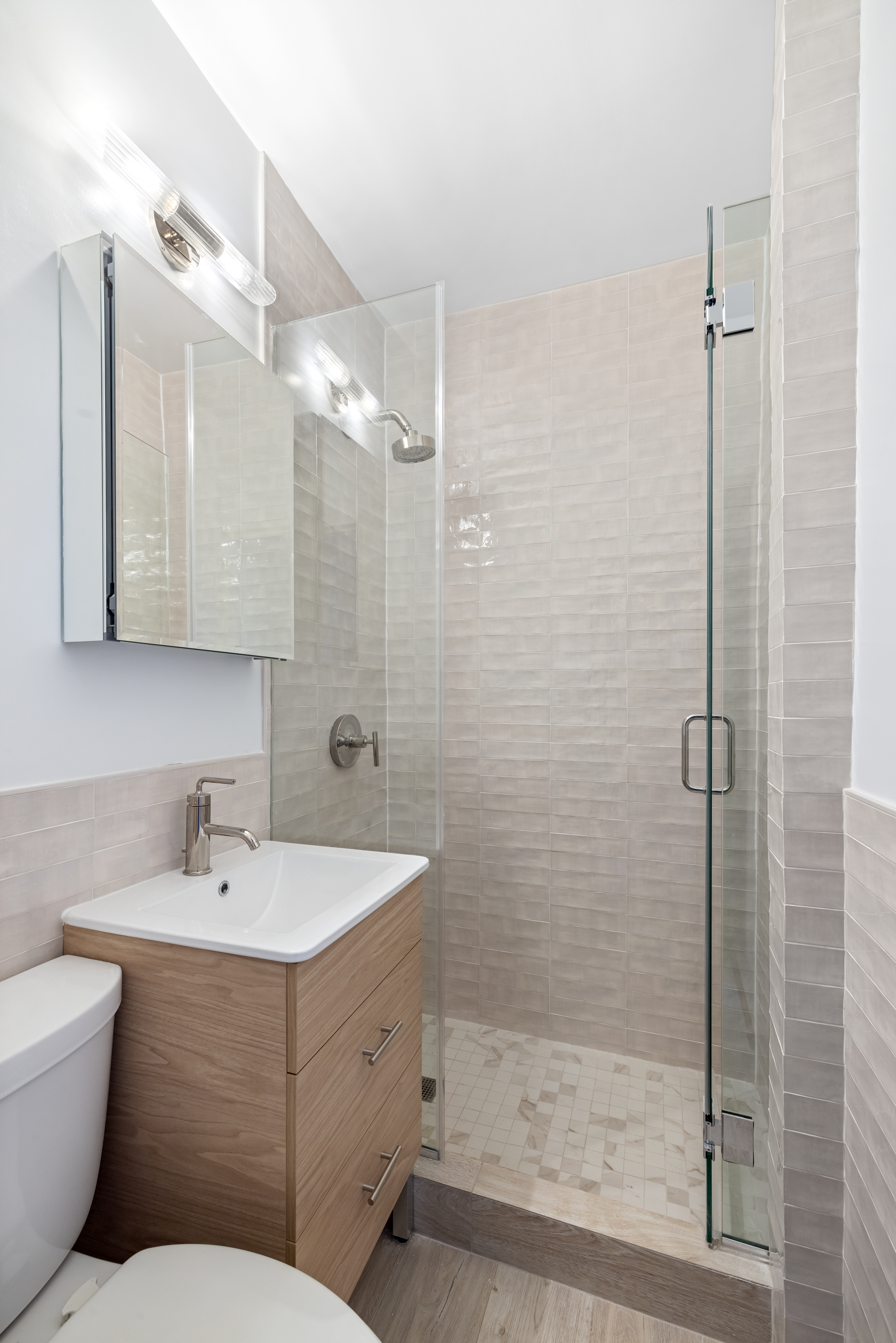 102 West 80th Street, Unit 42 Manhattan, NY 10024 - Photo 5 of 6 a bathroom with a toilet sink and shower