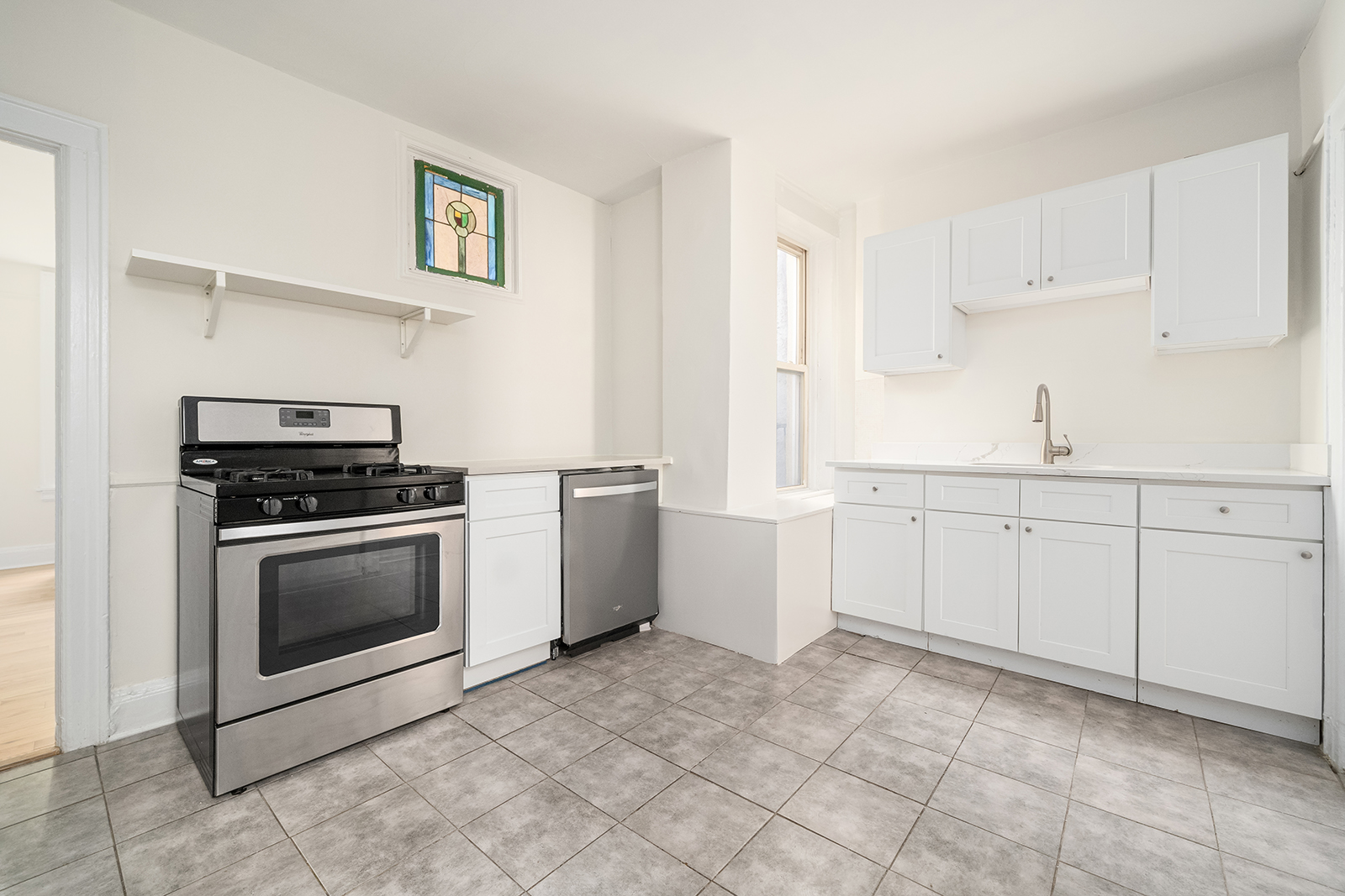 439 Union Street, Unit 3 Brooklyn, NY 11231 - Photo 5 of 9 a kitchen with white cabinets and white appliances