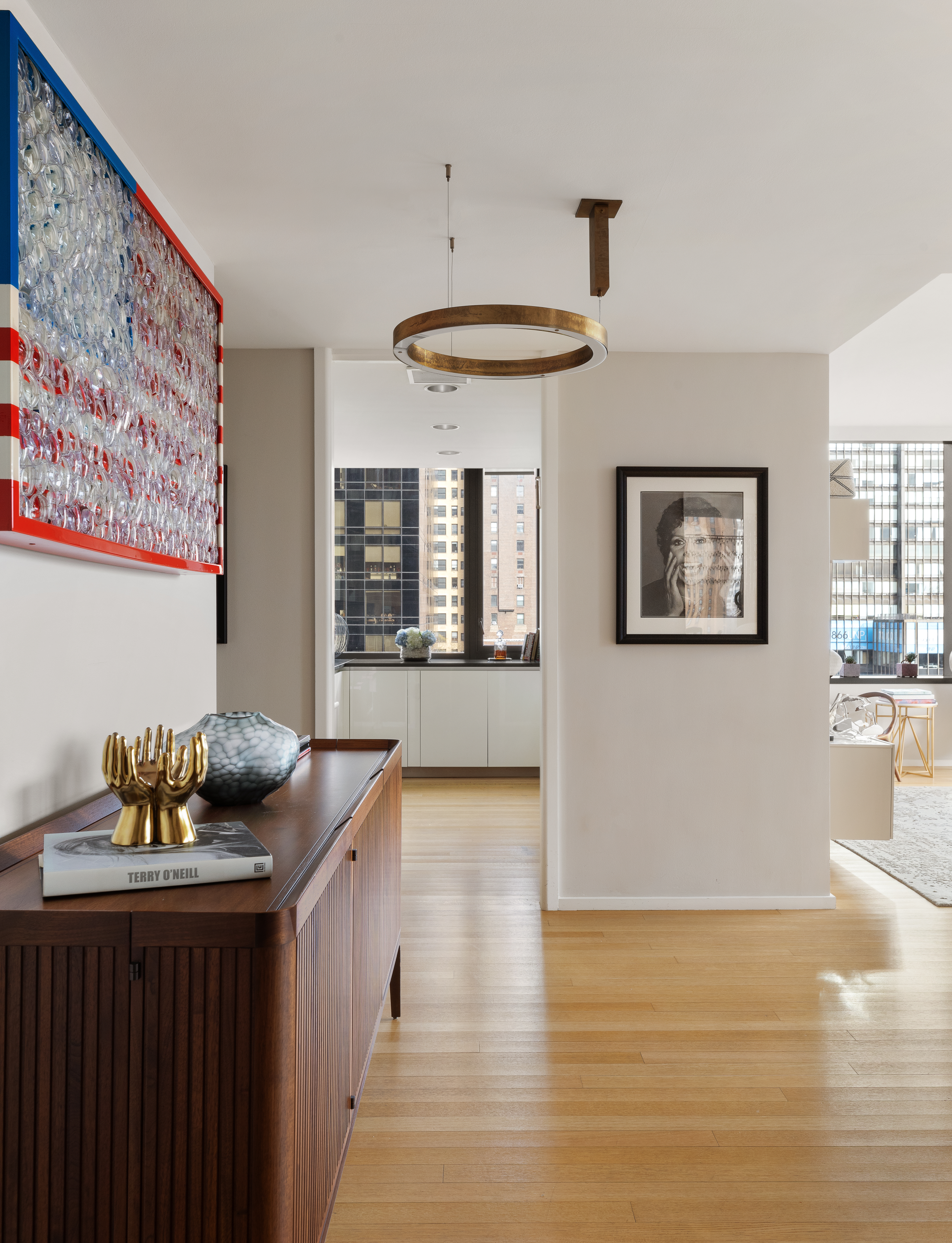 50 United Nations Plaza, Unit 6B Manhattan, NY 10017 - Photo 5 of 13 a living room with furniture and a wooden floor