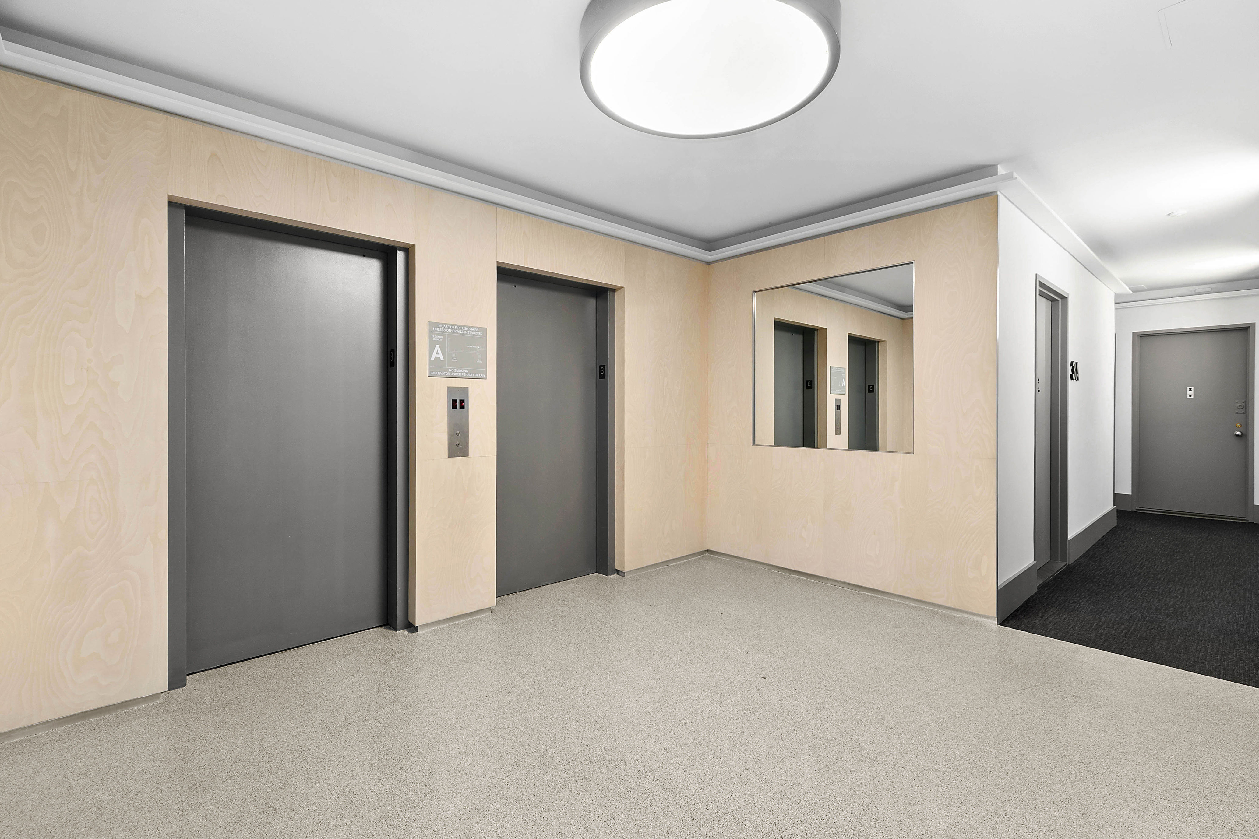 505 Court Street, Unit 3D Brooklyn, NY 11231 - Photo 9 of 14 an empty room with wooden floor and windows