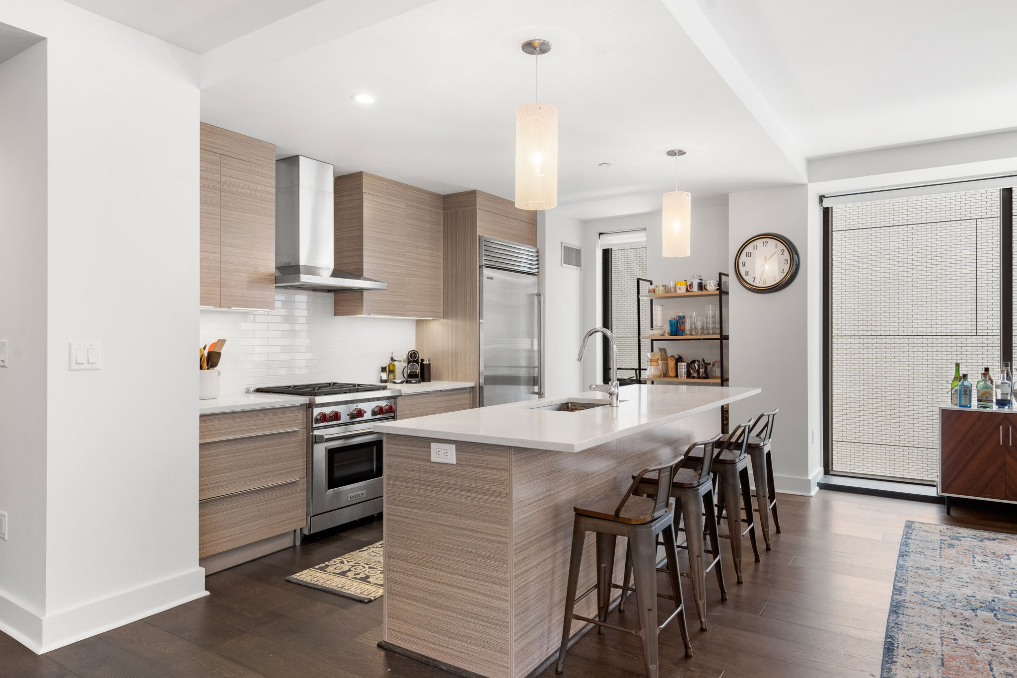 14 West Broadway, Unit 601 South Boston, MA 02127 - Photo 9 of 20 a kitchen with a table chairs stove and cabinets
