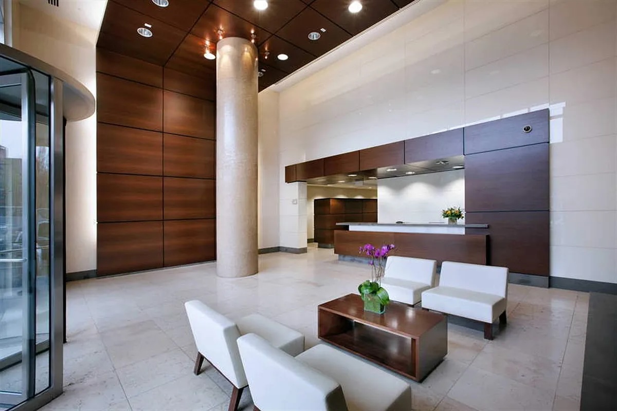 306 Gold Street, Unit 22B Brooklyn, NY 11201 - Photo 7 of 11 a living room with furniture and a chandelier