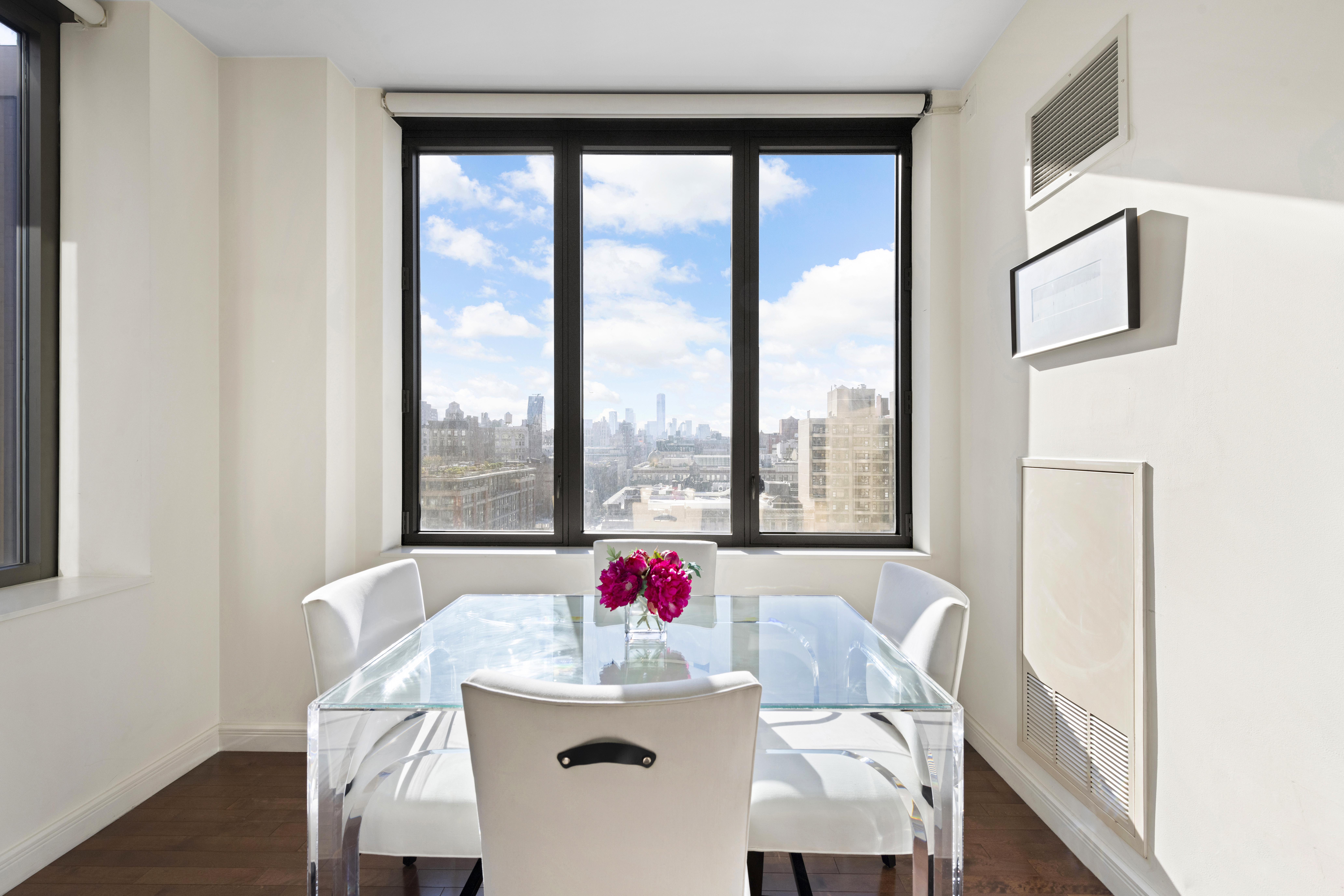 101 West 24th Street, Unit 12C Manhattan, NY 10011 - Photo 2 of 17 a view of dining room and livingroom with furniture
