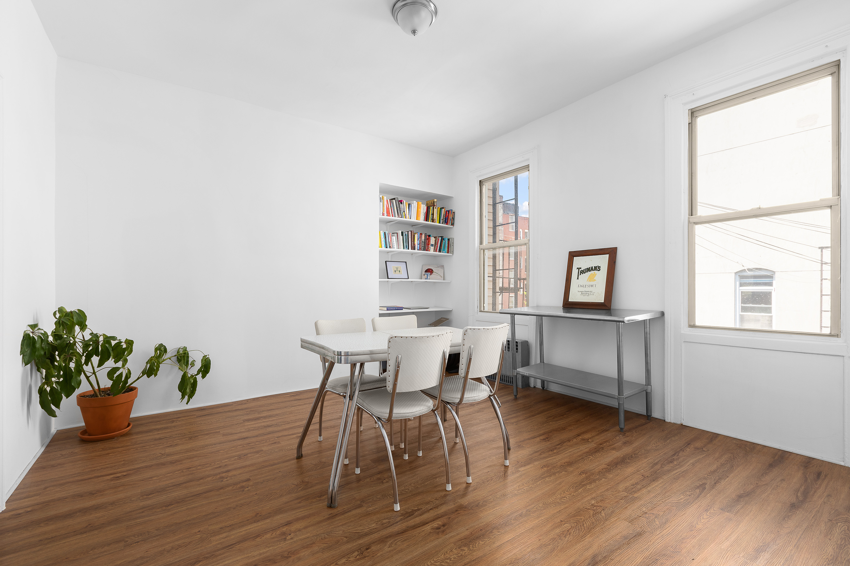 39 Broome Street Brooklyn, NY 11222 - Photo 9 of 16 a view of a dining room with furniture and wooden floor