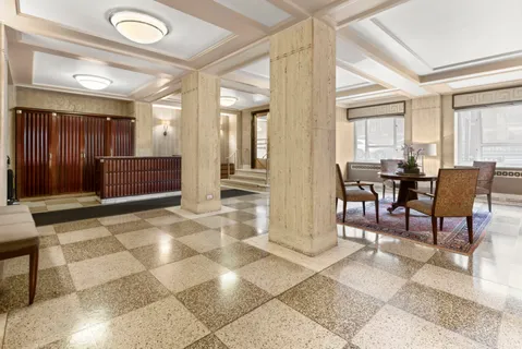 a living room with furniture and outdoor space