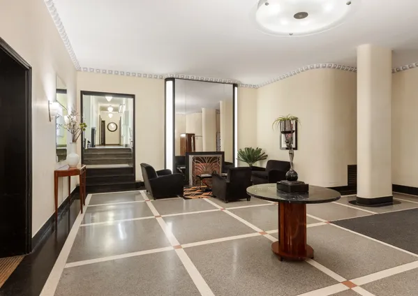 a room with lots of tables and chairs