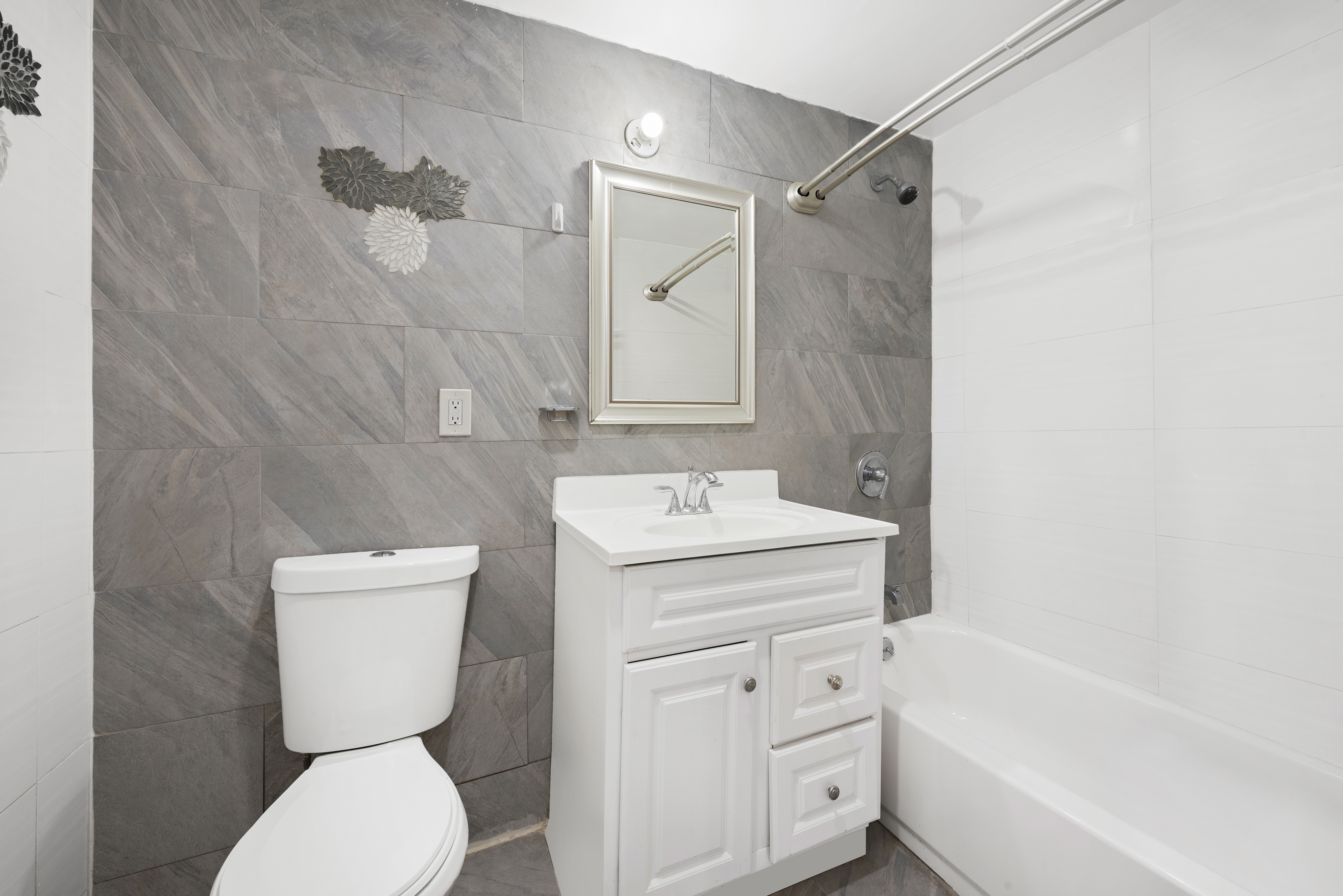 654 Lafayette Avenue, Unit GARDENA Brooklyn, NY 11216 - Photo 12 of 14 a bathroom with a toilet sink and mirror