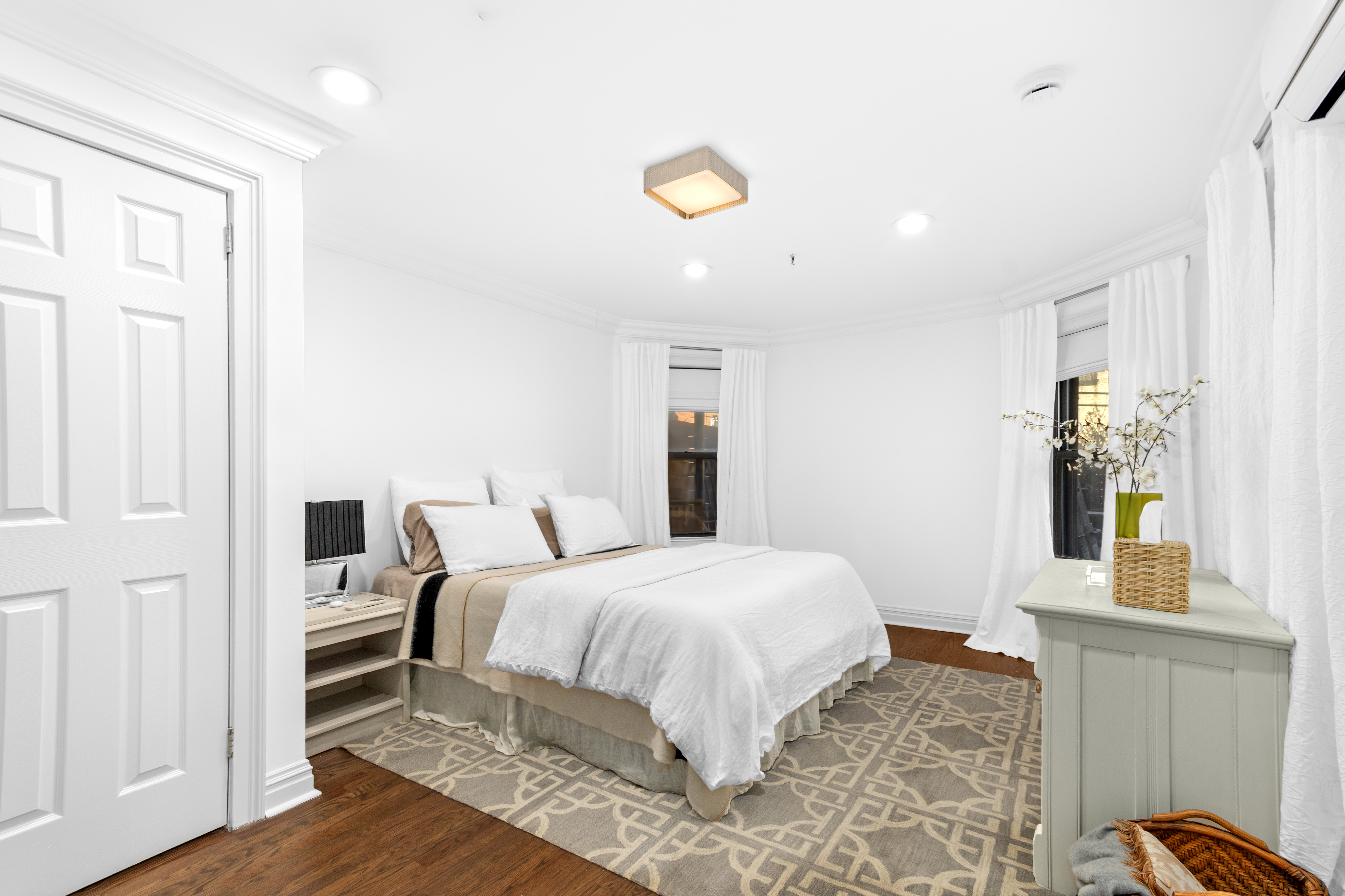 191 MacDonough Street, Unit 2 Brooklyn, NY 11216 - Photo 2 of 7 a bedroom with a bed and wooden floor