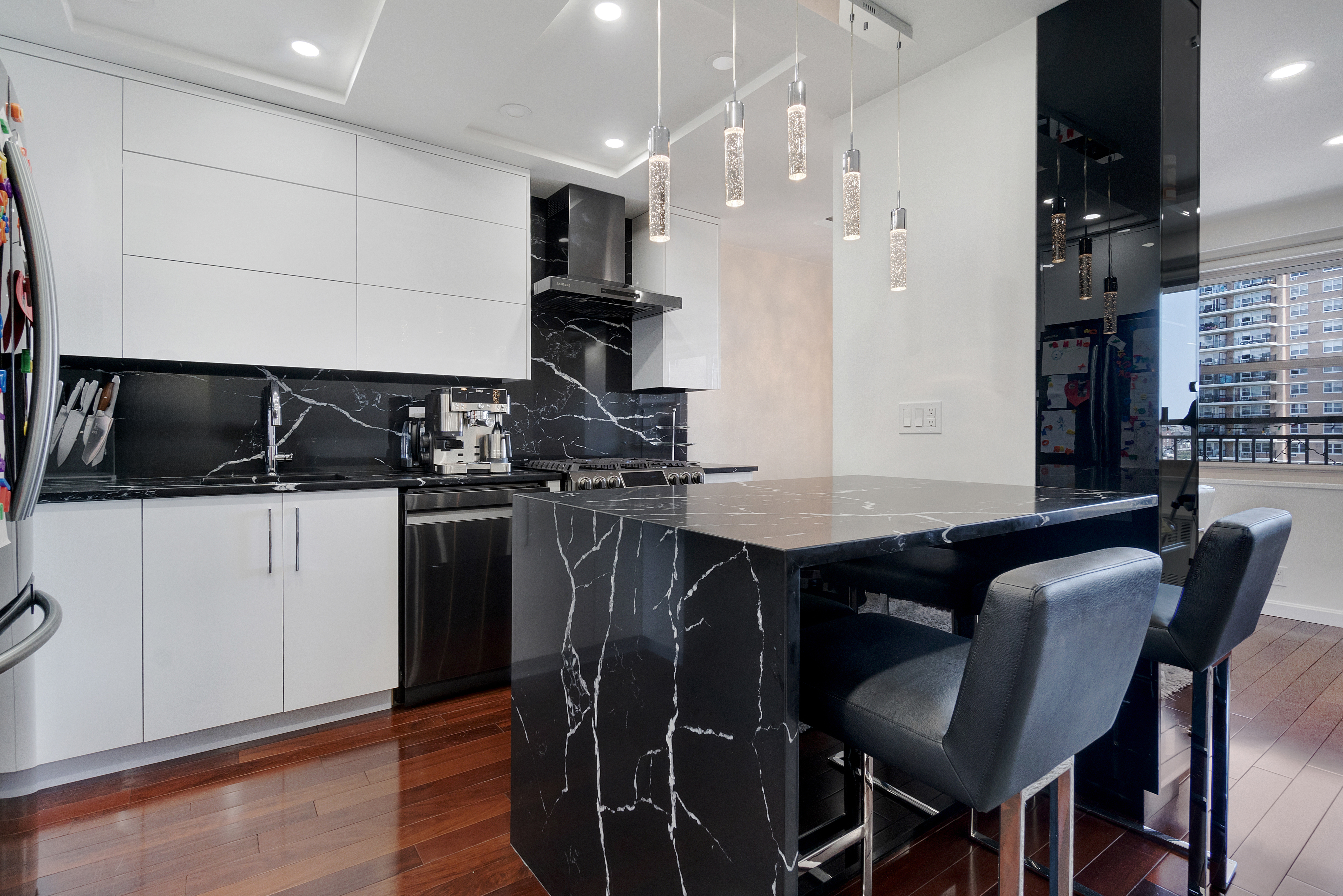 448 Neptune Avenue, Unit 14L Brooklyn, NY 11224 - Photo 2 of 20 a kitchen with a table and chairs in it