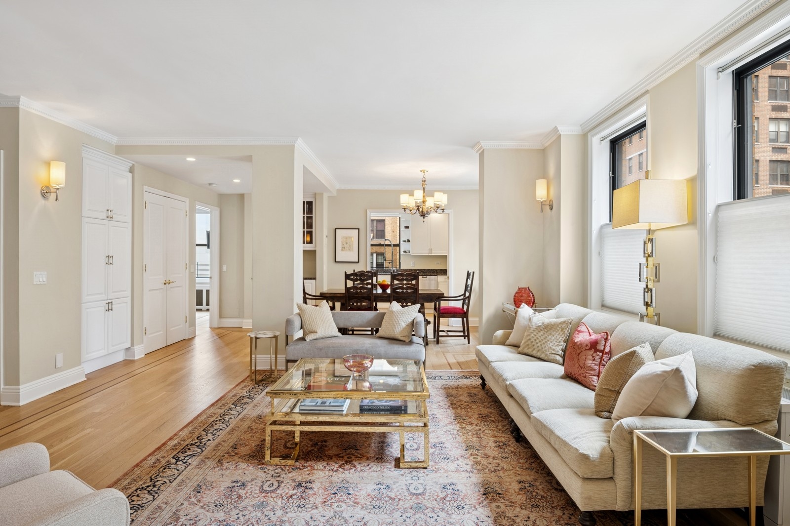 514 West End Avenue, Unit 8/9A Manhattan, NY 10024 - Photo 3 of 24 a living room with furniture wooden floor and a large window