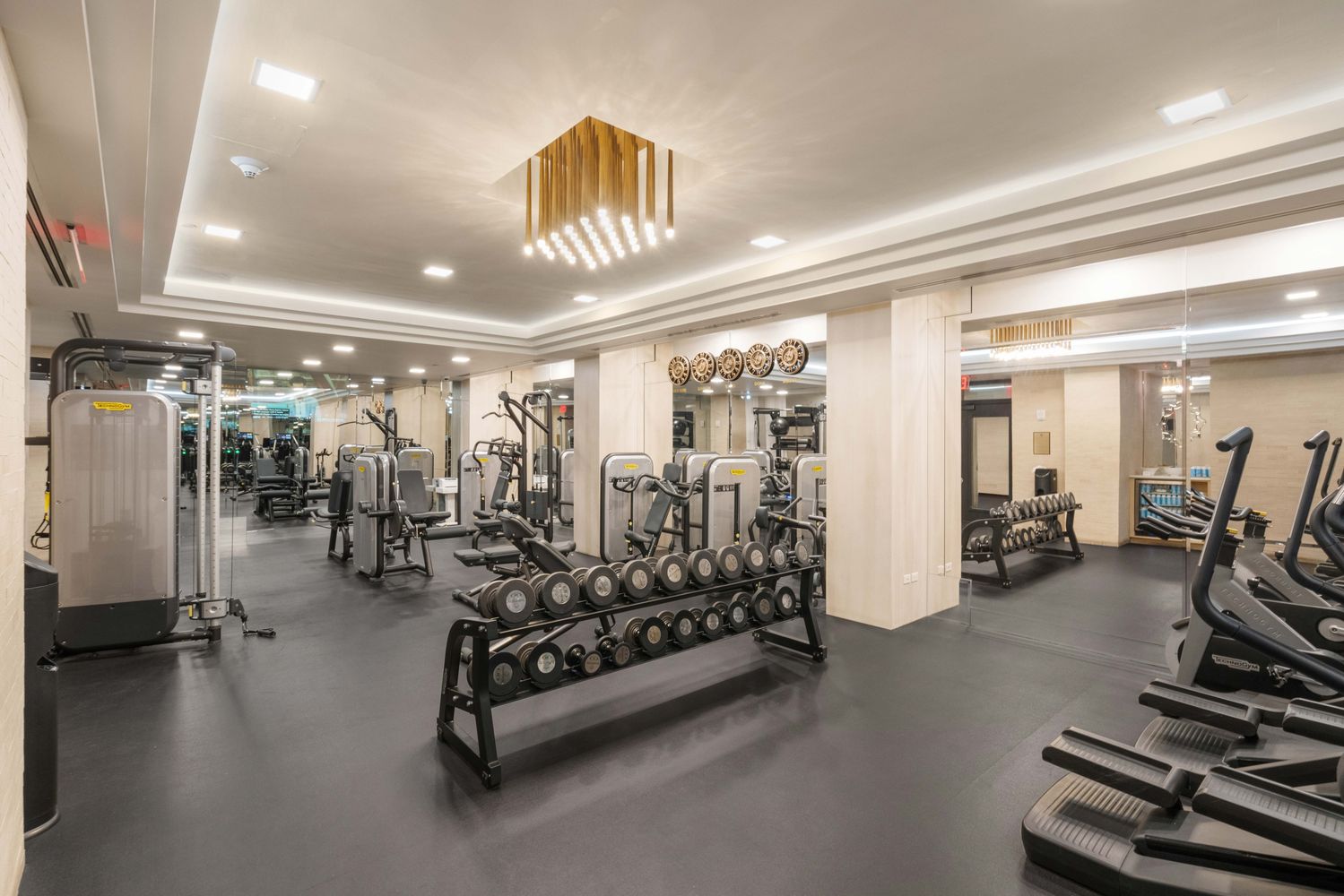 1 Central Park South, Unit 1013 Manhattan, NY 10019 - Photo 28 of 32 a view of a room with gym equipment