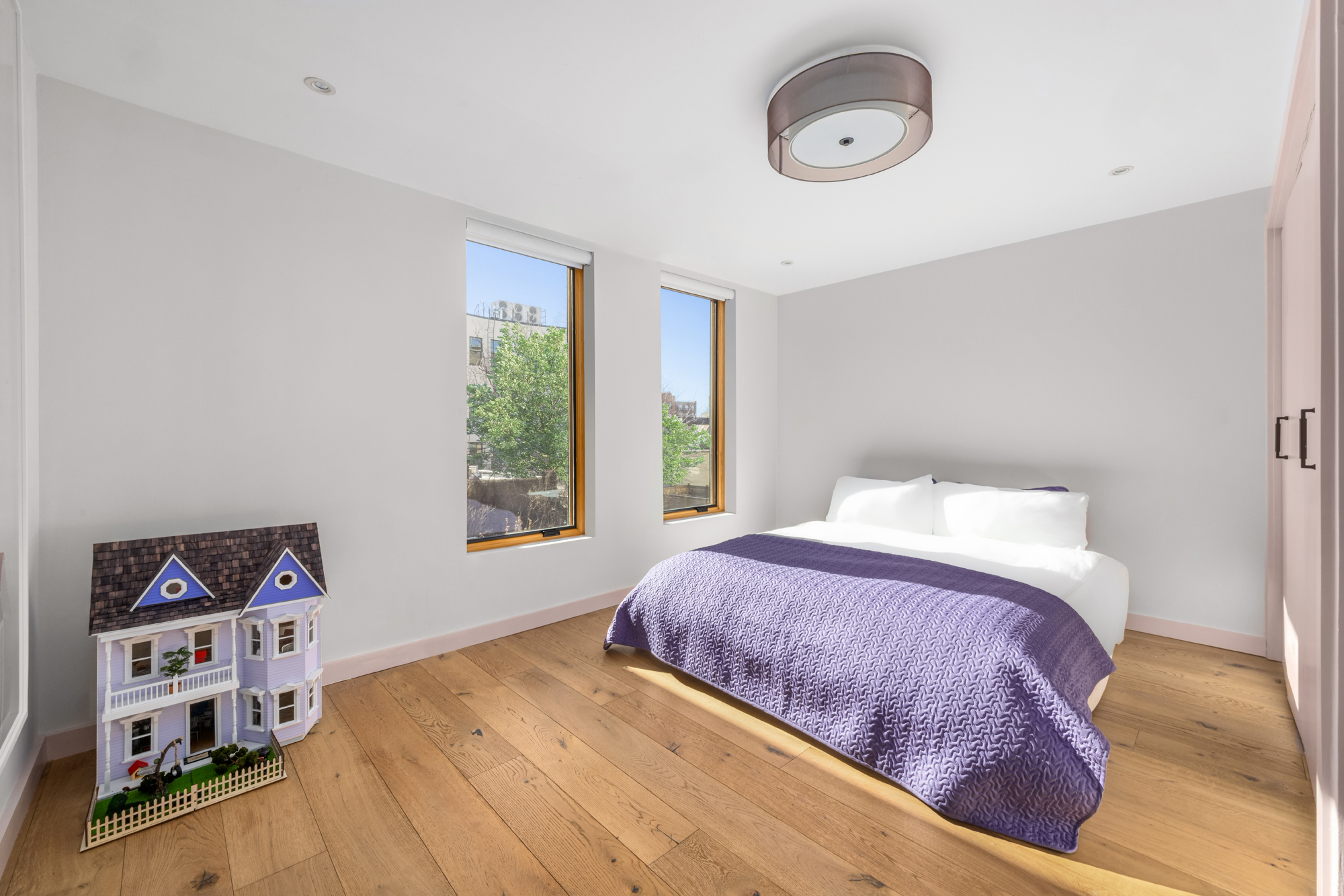 683 Leonard Street Brooklyn, NY 11222 - Photo 21 of 25 a bedroom with a bed and a window