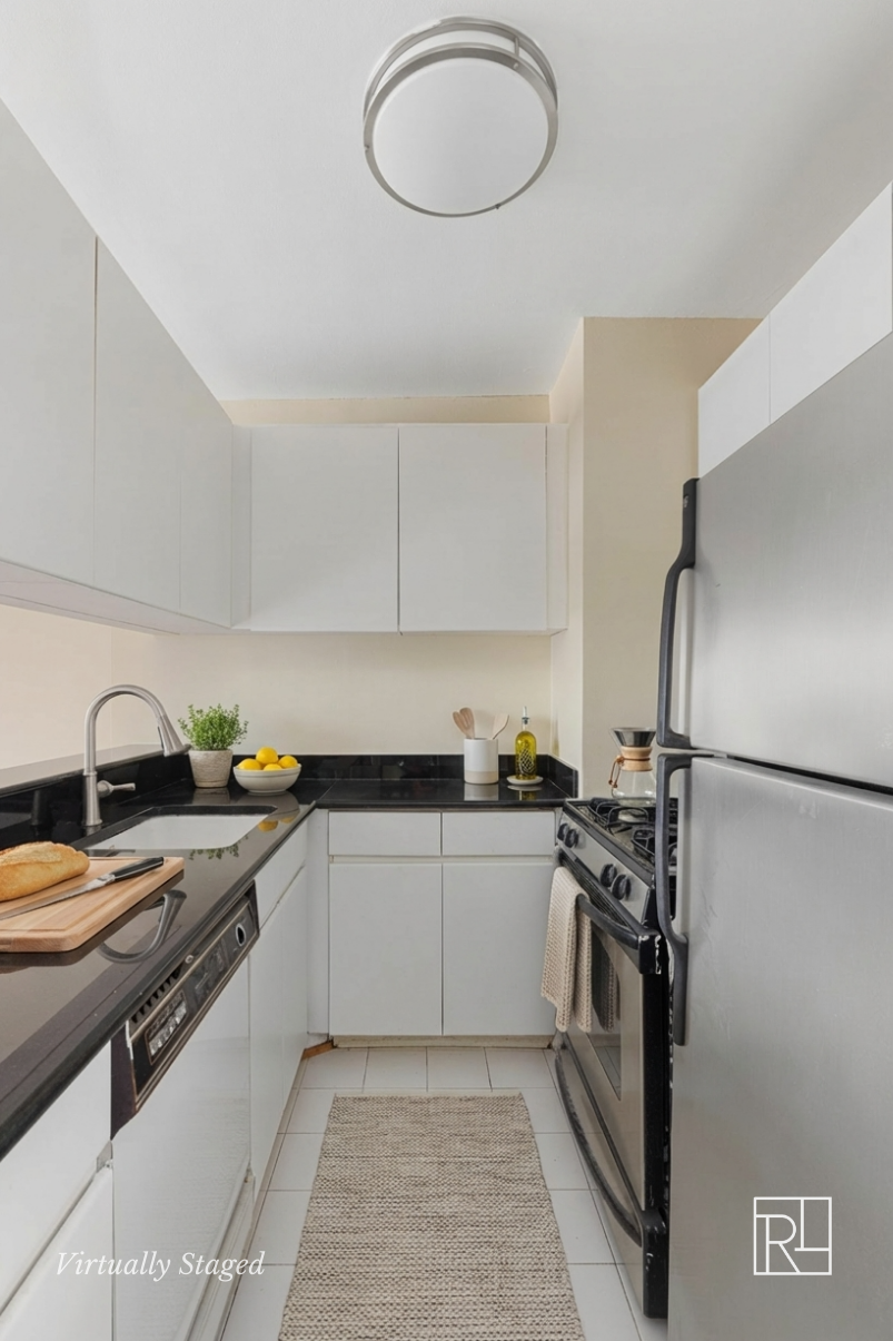 300 East 62nd Street, Unit 1501 Manhattan, NY 10065 - Photo 8 of 14 a kitchen with stainless steel appliances granite countertop a stove a sink dishwasher and a refrigerator