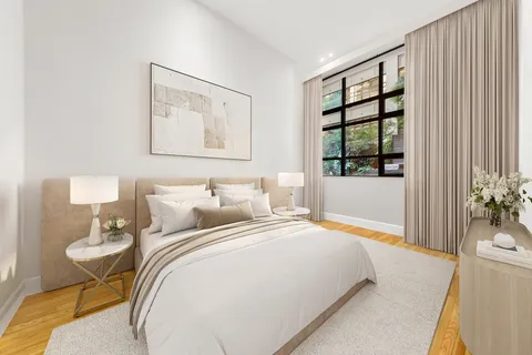 a bedroom with bed and a window