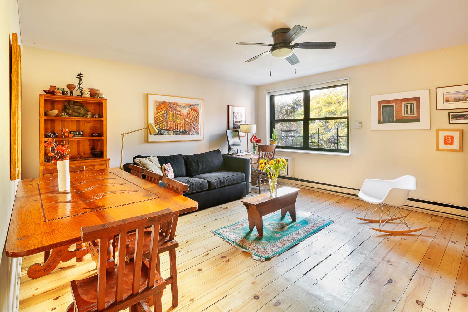 129 Barrow Street, Unit 3A Manhattan, NY 10014 - Photo 2 of 10 a living room with furniture and a large window