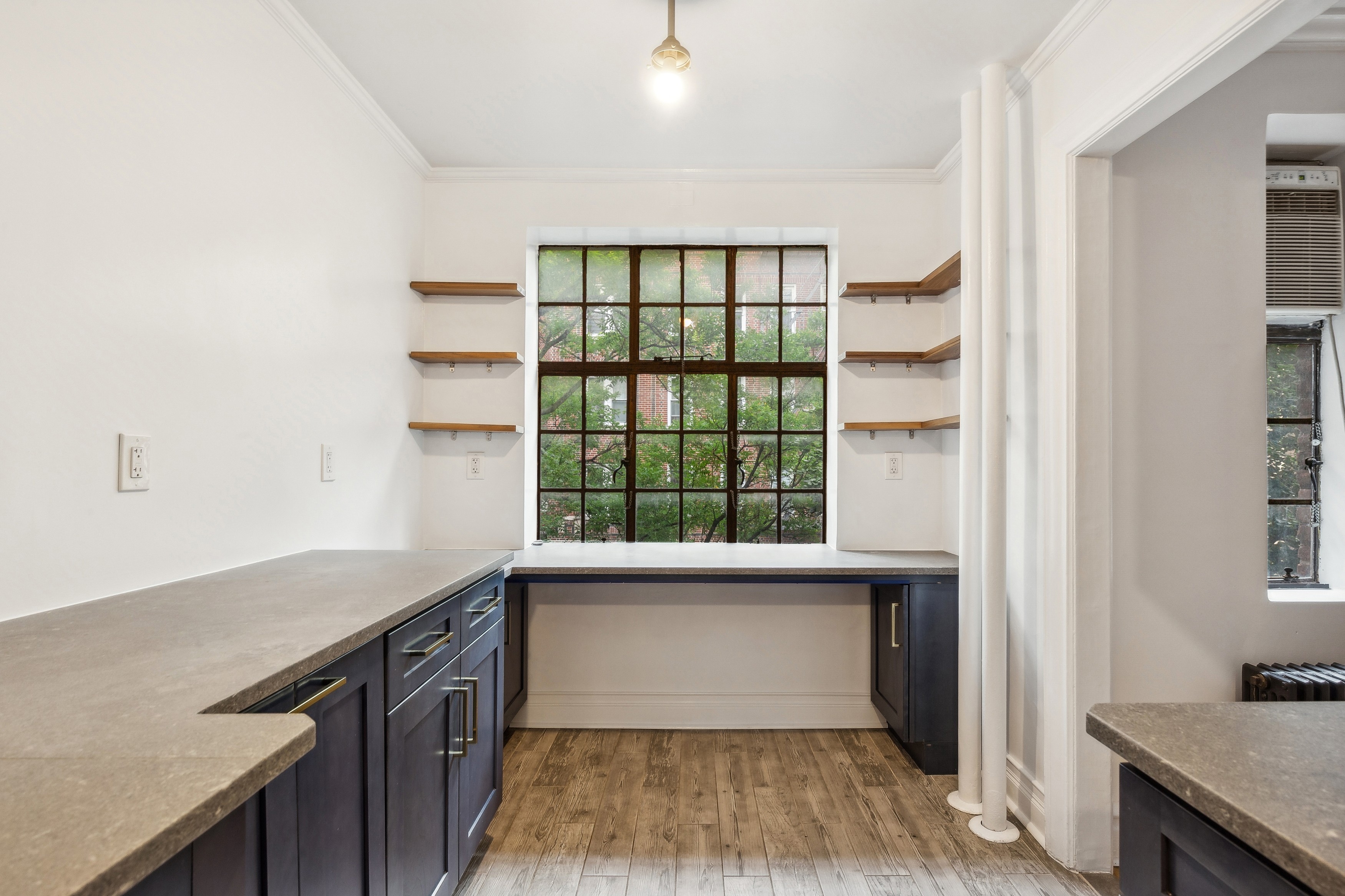 116 Pinehurst Avenue, Unit H32 Manhattan, NY 10033 - Photo 2 of 21 a view of a kitchen with a sink and dishwasher