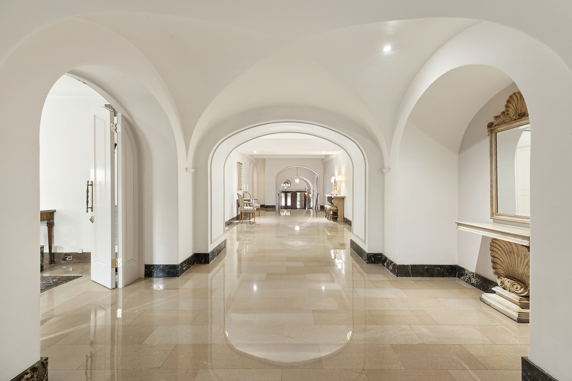 575 Park Avenue, Unit 1403 Manhattan, NY 10065 - Photo 11 of 15 a view of a livingroom with wooden floor