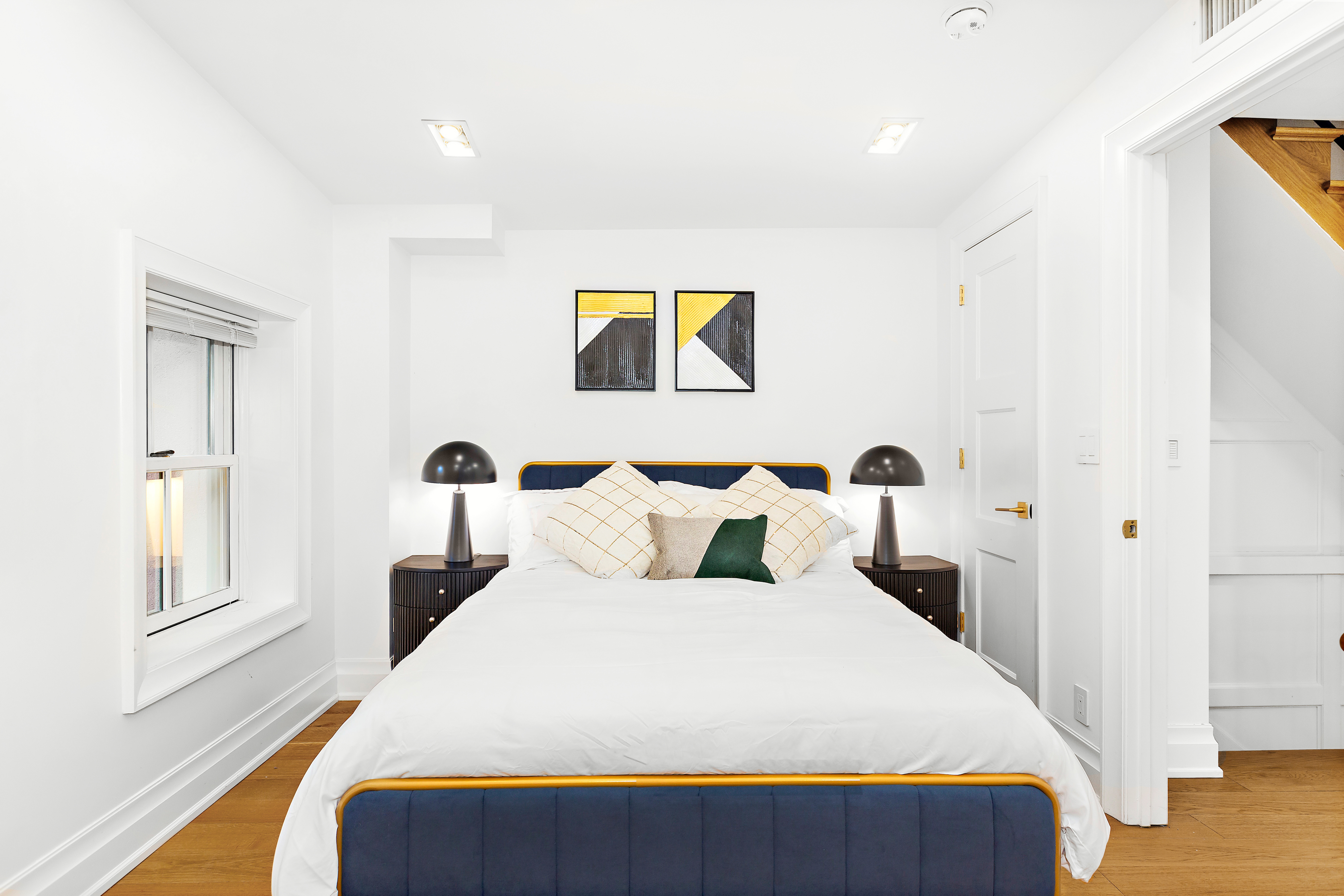 134 East 36th Street Manhattan, NY 10016 - Photo 25 of 28 a bedroom with bed and window