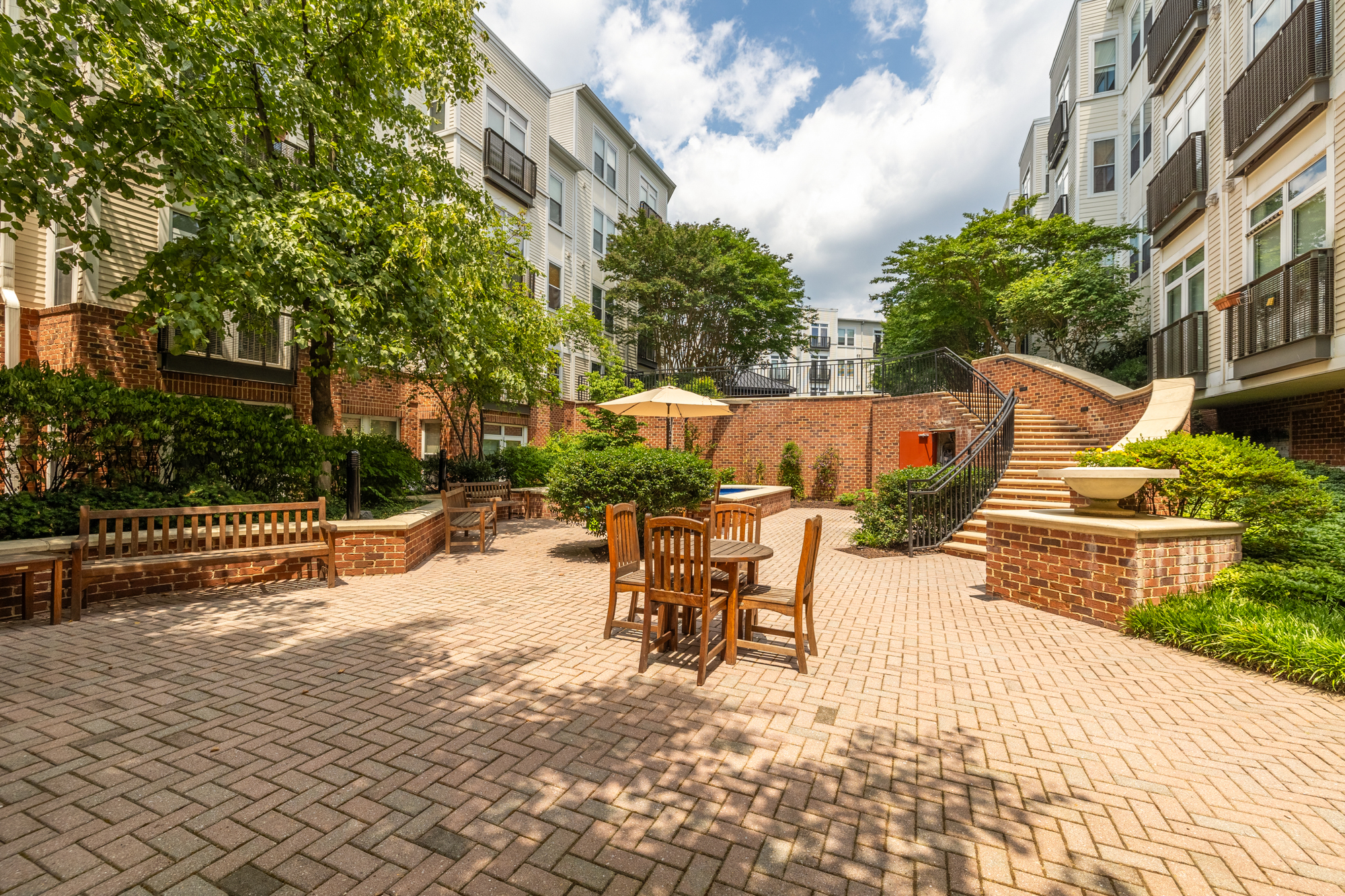1391 Pennsylvania Ave. Southeast, Unit 324 Washington, DC 20003 - Photo 29 of 33 a view of a patio with couches table and chairs and potted plants