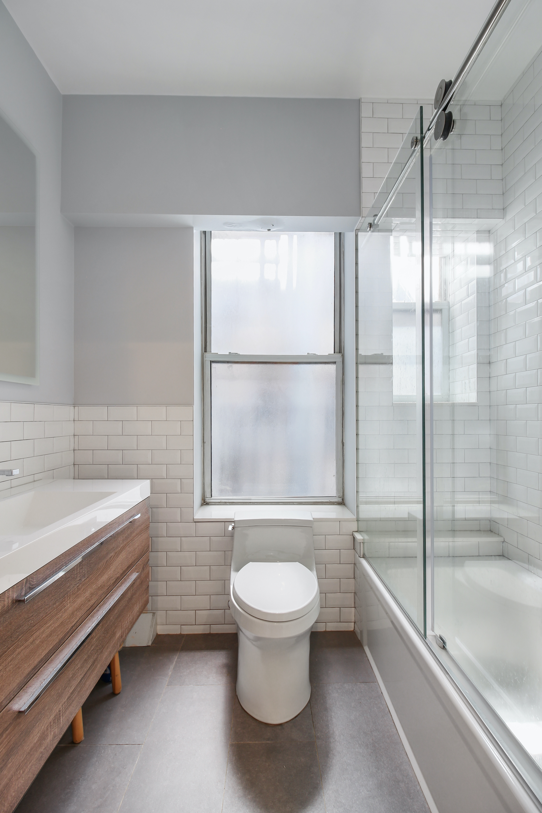 124 Thompson Street, Unit 11/12 Manhattan, NY 10012 - Photo 12 of 13 a bathroom with a toilet and a bathtub