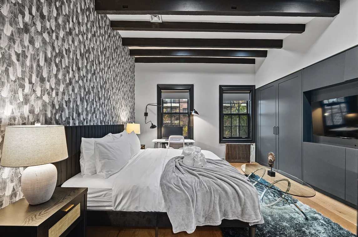 58 Downing Street Manhattan, NY 10014 - Photo 13 of 21 a bedroom with bed and a flat screen tv