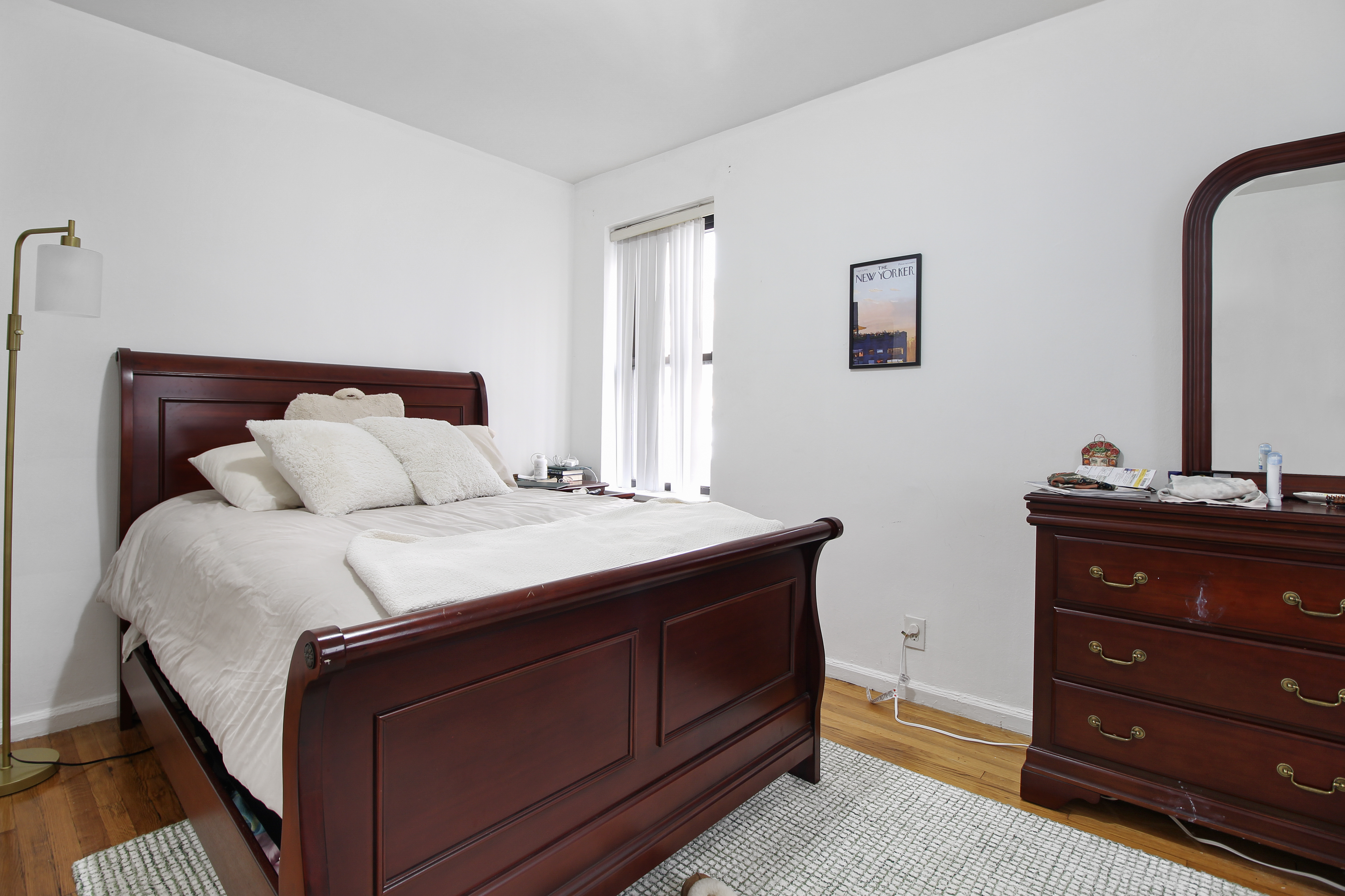 315 East 56th Street, Unit 5F Manhattan, NY 10022 - Photo 7 of 9 a bedroom with a bed and a dresser