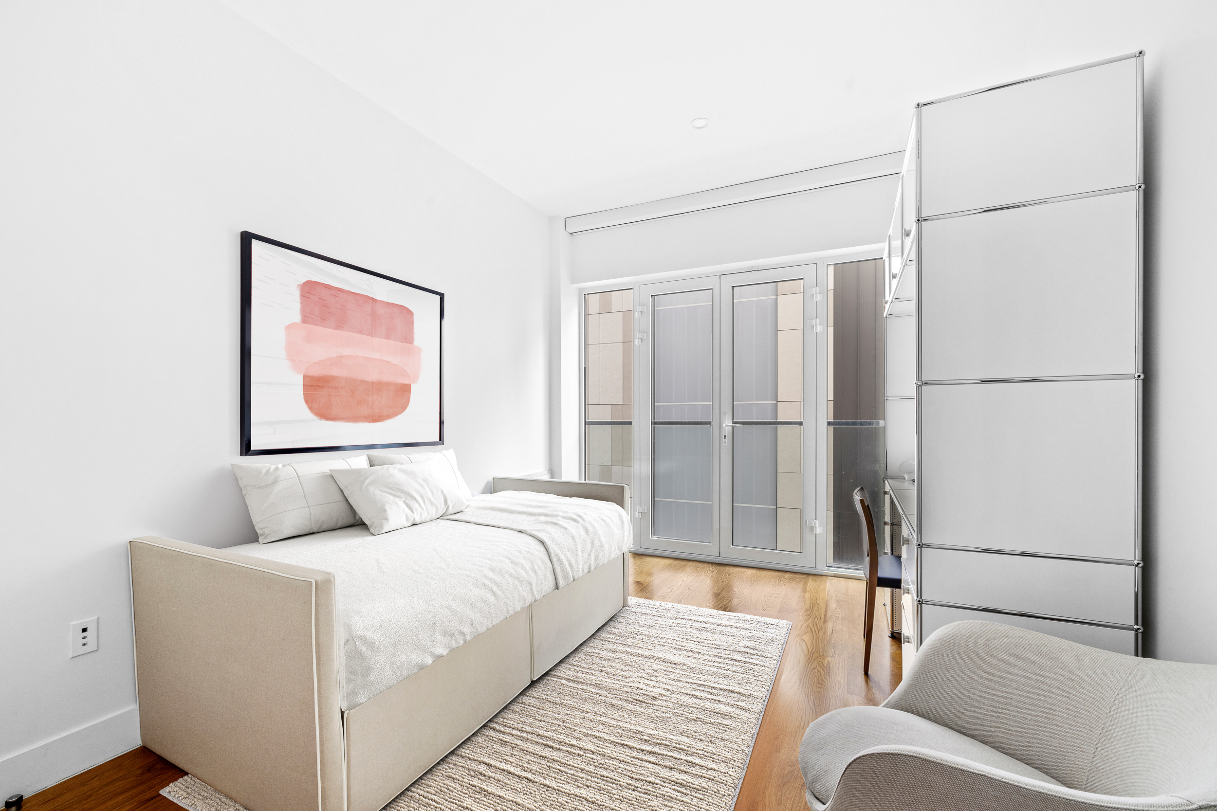 427 East 90th Street, Unit 5A Manhattan, NY 10128 - Photo 7 of 13 a bedroom with a bed and a couch