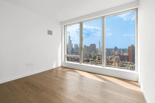 a bathroom with a sink toilet vanity and shower