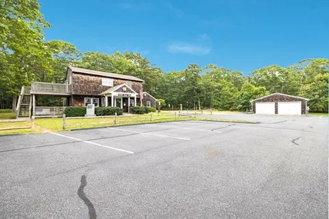 a view of a swimming pool with an outdoor space and seating area