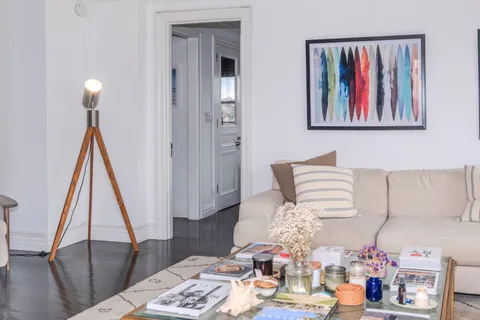 a bed room with furniture and wooden floor