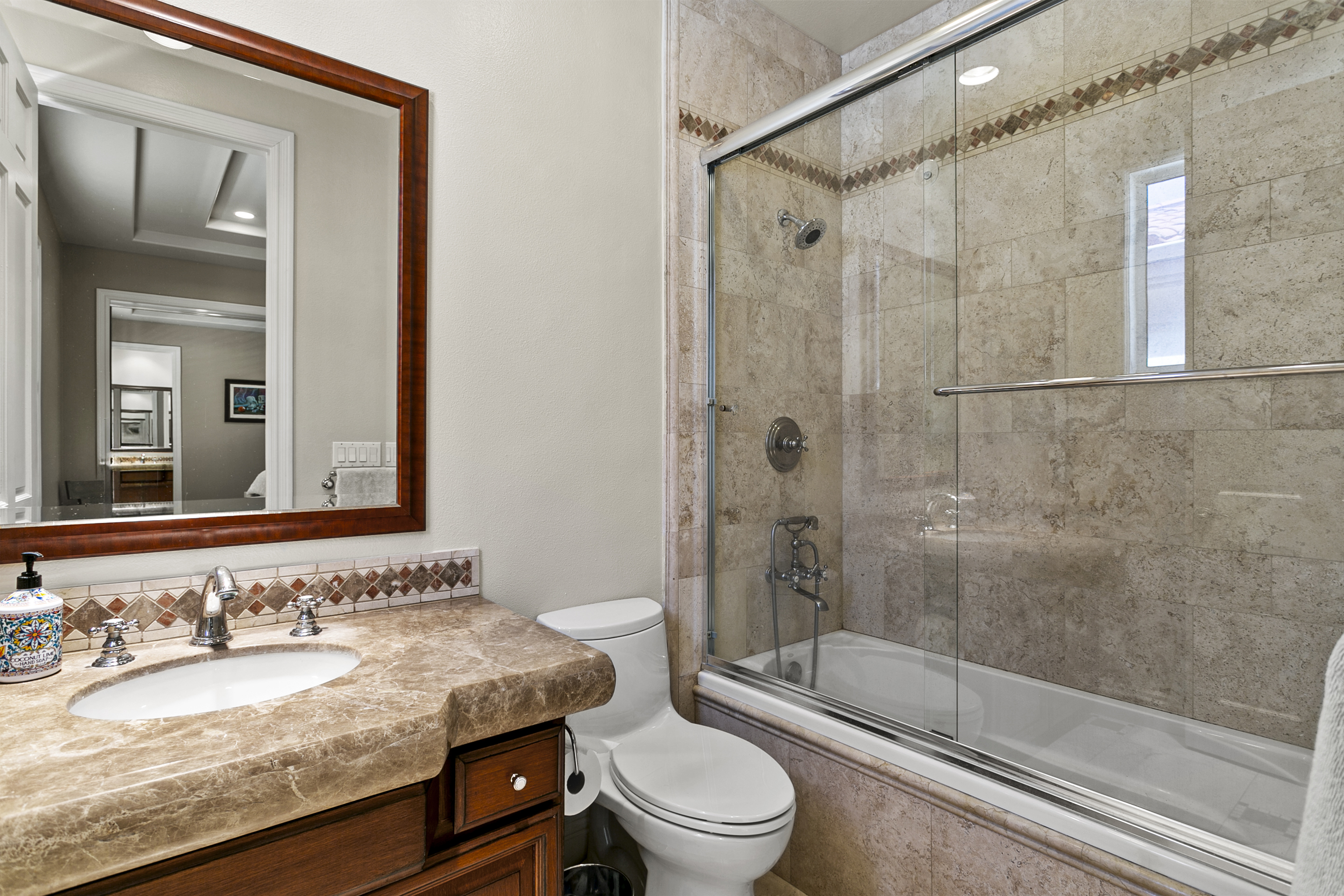 10 Vista Montemar Laguna Niguel, CA 92677 - Photo 36 of 67 a bathroom with a granite countertop sink toilet mirror and shower