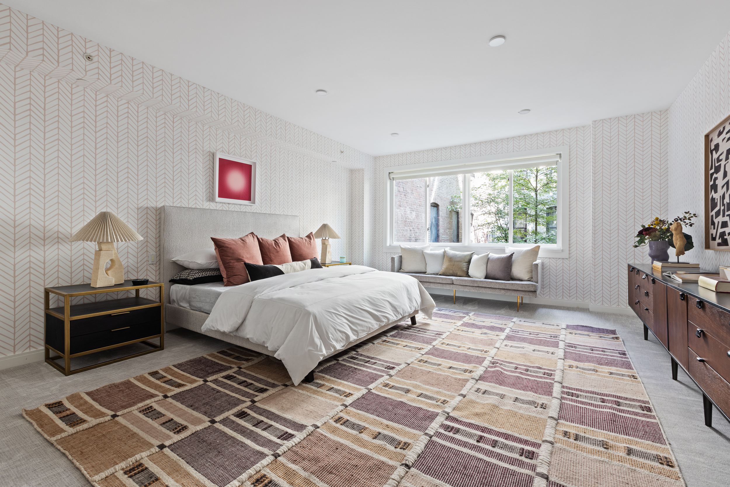 95 Charles Street, Unit TH Manhattan, NY 10014 - Photo 14 of 29 a spacious bedroom with a bed a couch and a window