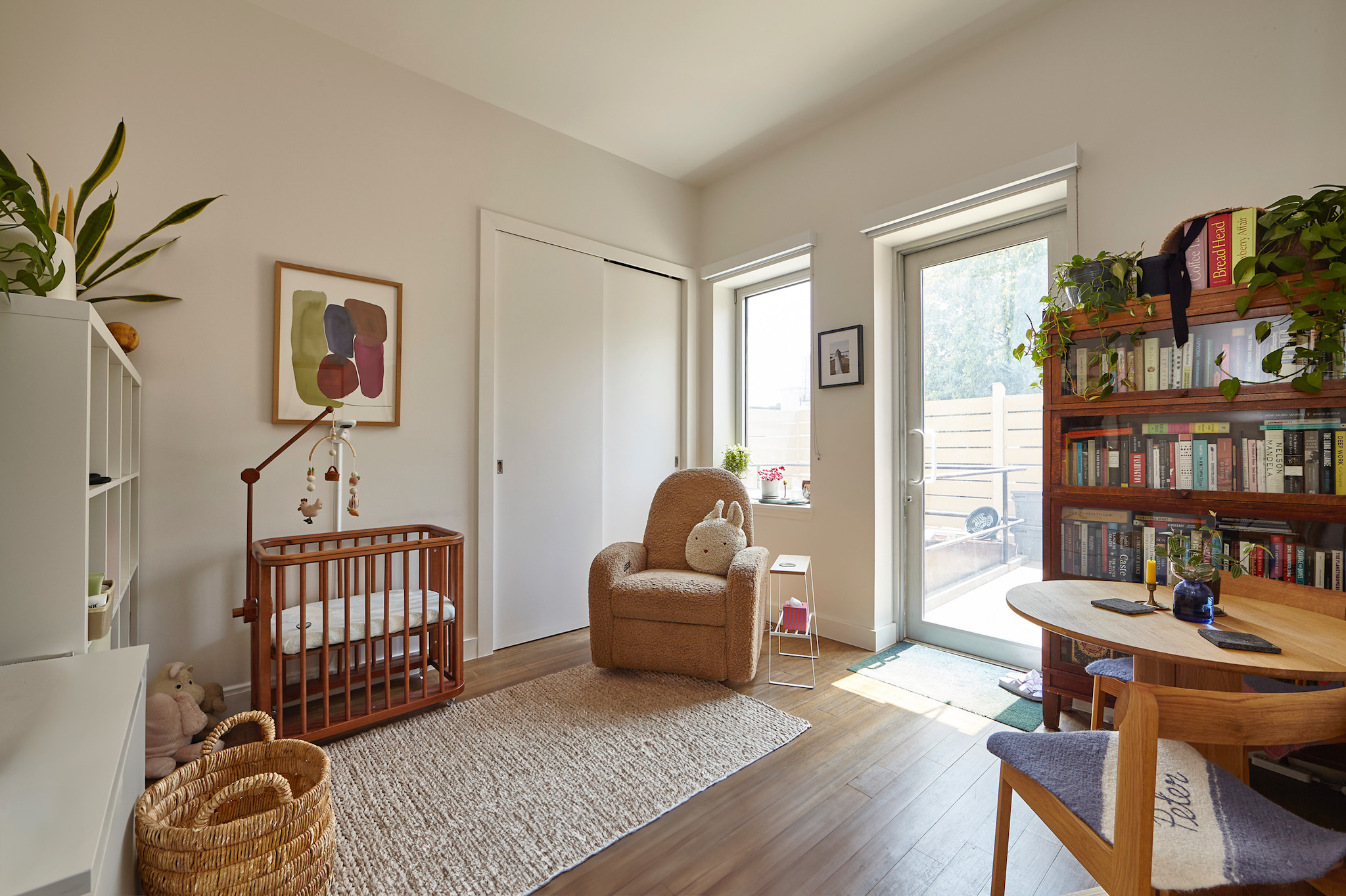 144 North 10th Street, Unit 2D Brooklyn, NY 11249 - Photo 7 of 12 a living room with furniture and a book shelf