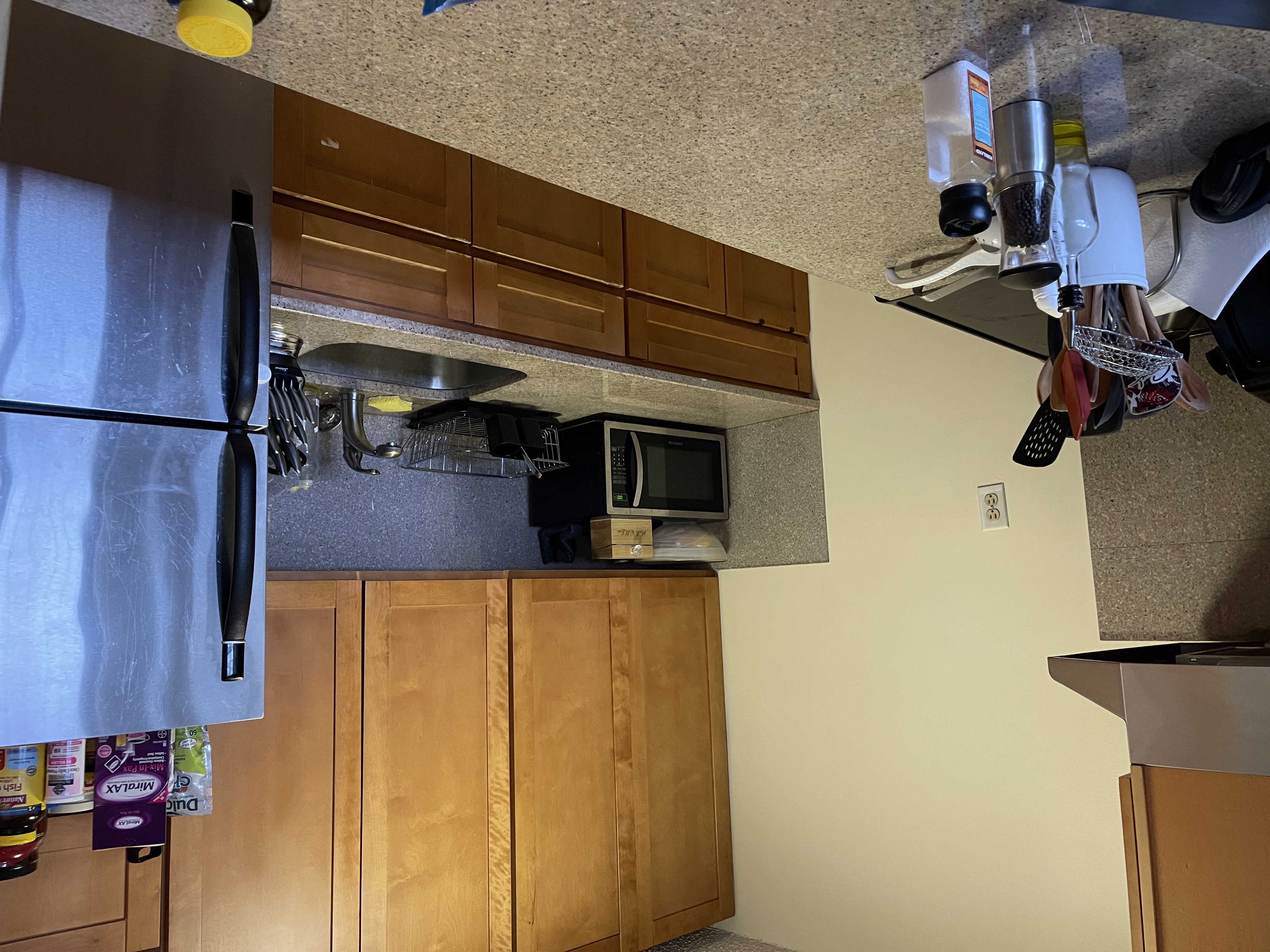 25-40 Shore Boulevard, Unit 5B Queens, NY 11102 - Photo 3 of 17 a kitchen with stainless steel appliances granite countertop a refrigerator and a stove top oven