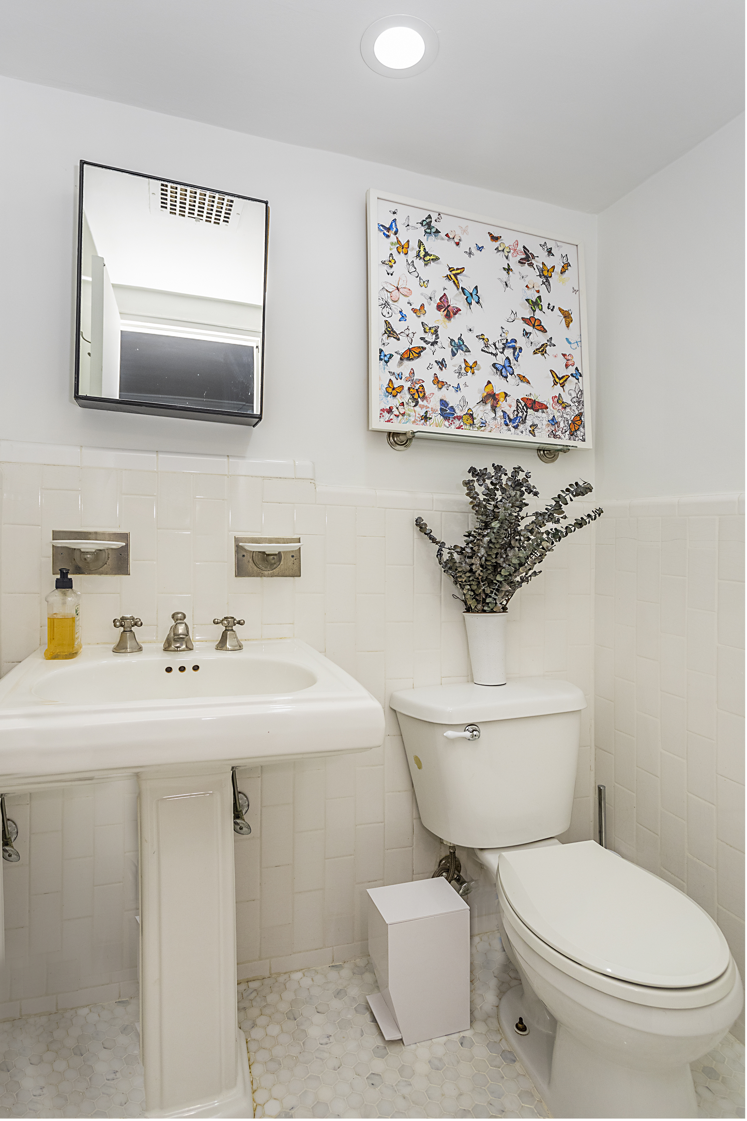 250 West 15th Street, Unit 3C Manhattan, NY 10011 - Photo 8 of 9 a bathroom with a toilet sink and mirror