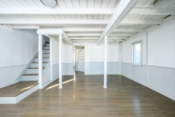 a view of an entryway with wooden floor