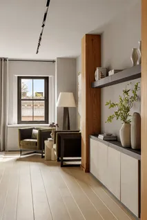 a living room with furniture and a window