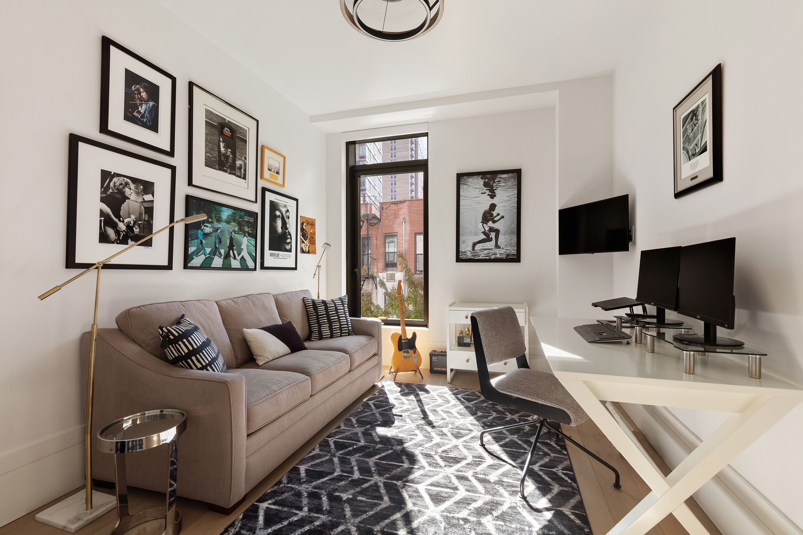 310 East 86th Street, Unit 4B Manhattan, NY 10028 - Photo 16 of 25 a living room with furniture and a flat screen tv