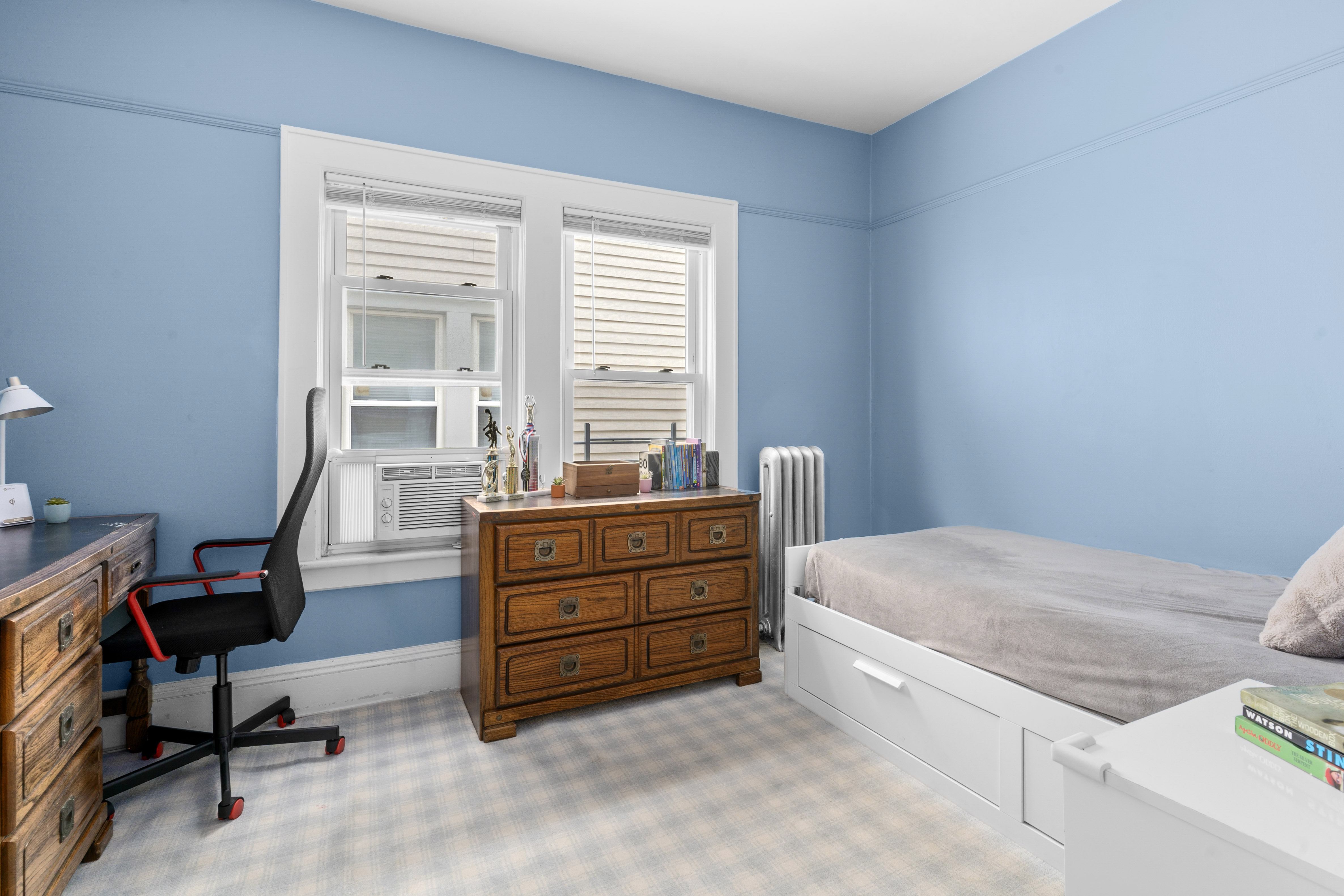 1065 East 39th Street Brooklyn, NY 11210 - Photo 5 of 15 a bed room with a bed and a chair