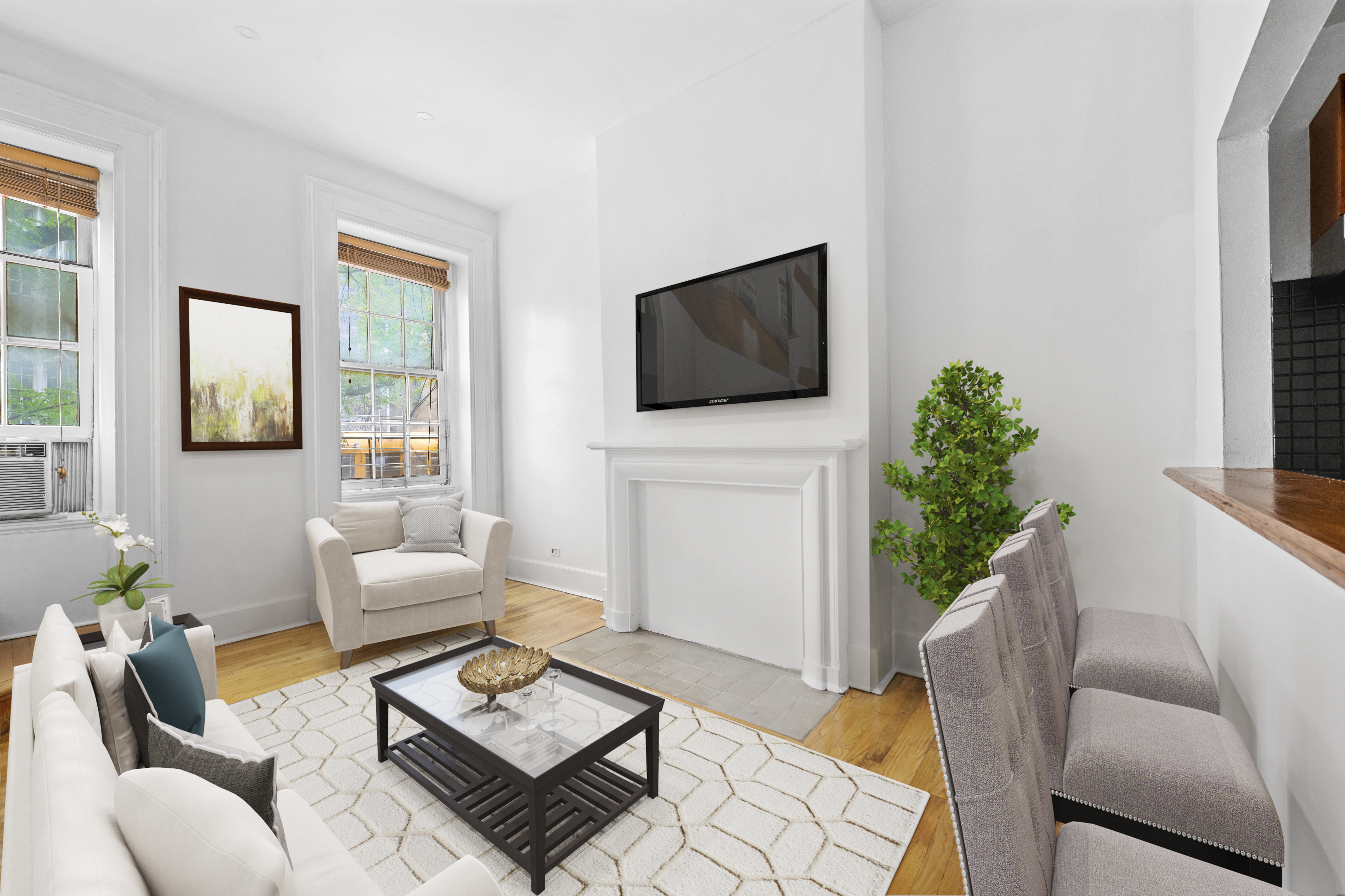 a living room with furniture and a flat screen tv